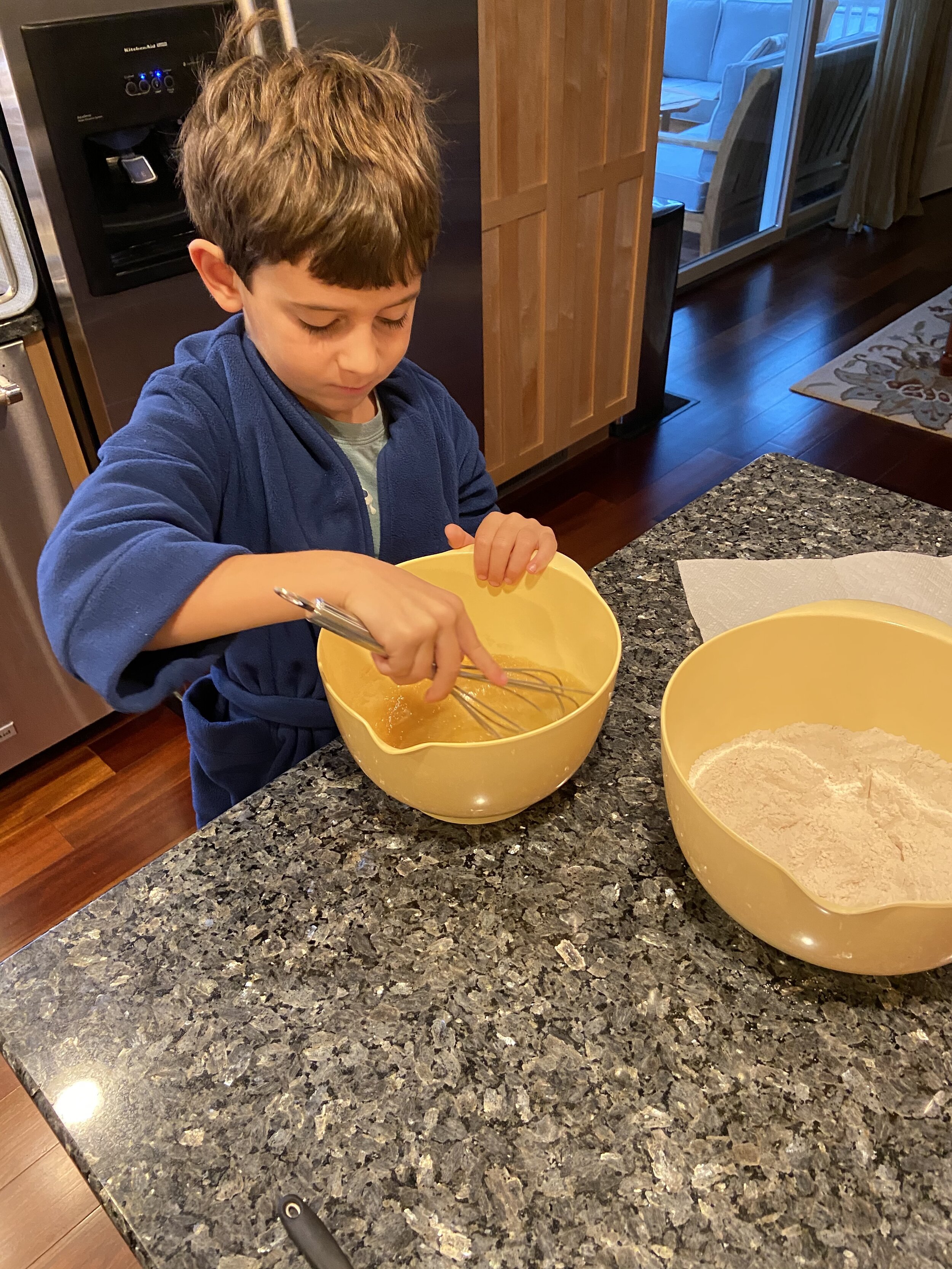 Making a birthday cake for his sister.