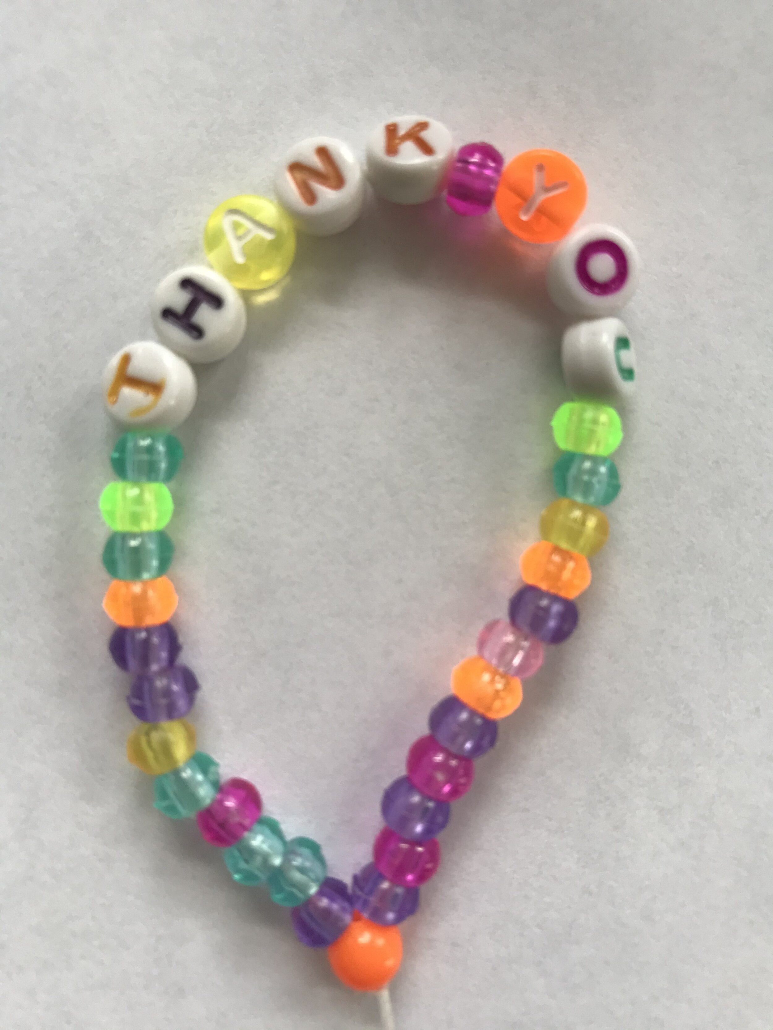 A badge made for a grocery store worker.