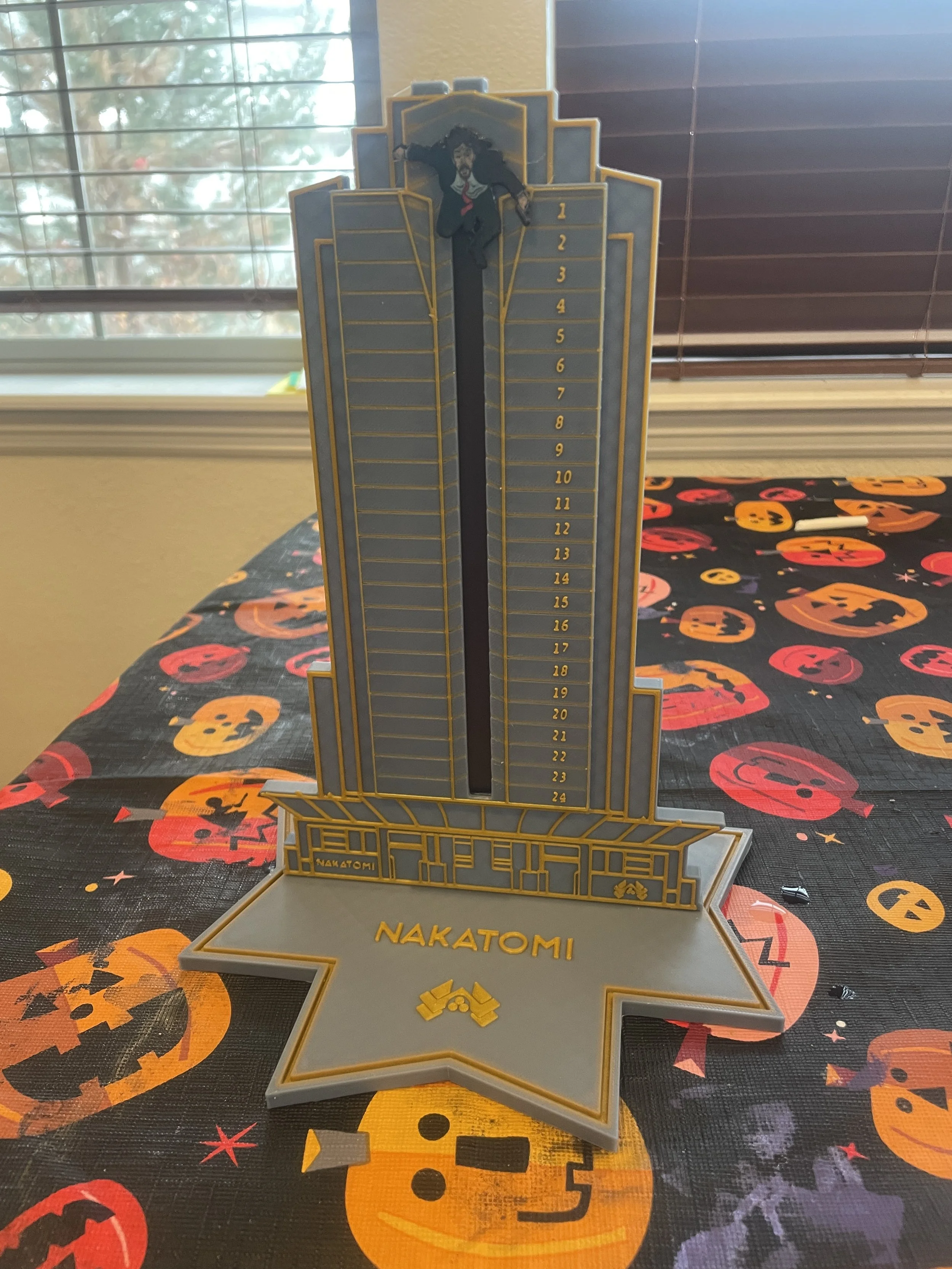 Hans Gruber from Die Hard falling off of Nakatomi Plaza