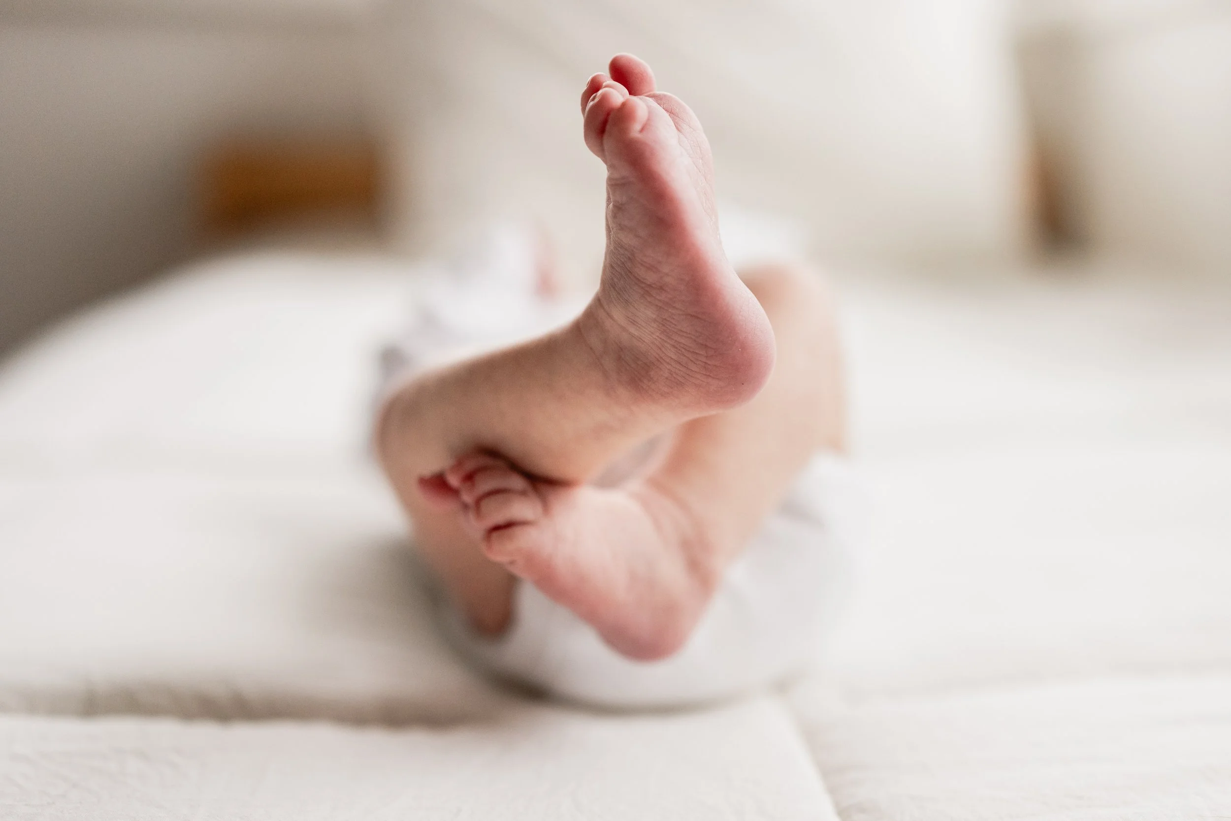 Natural newborn feet taken during an in home session in Seattle