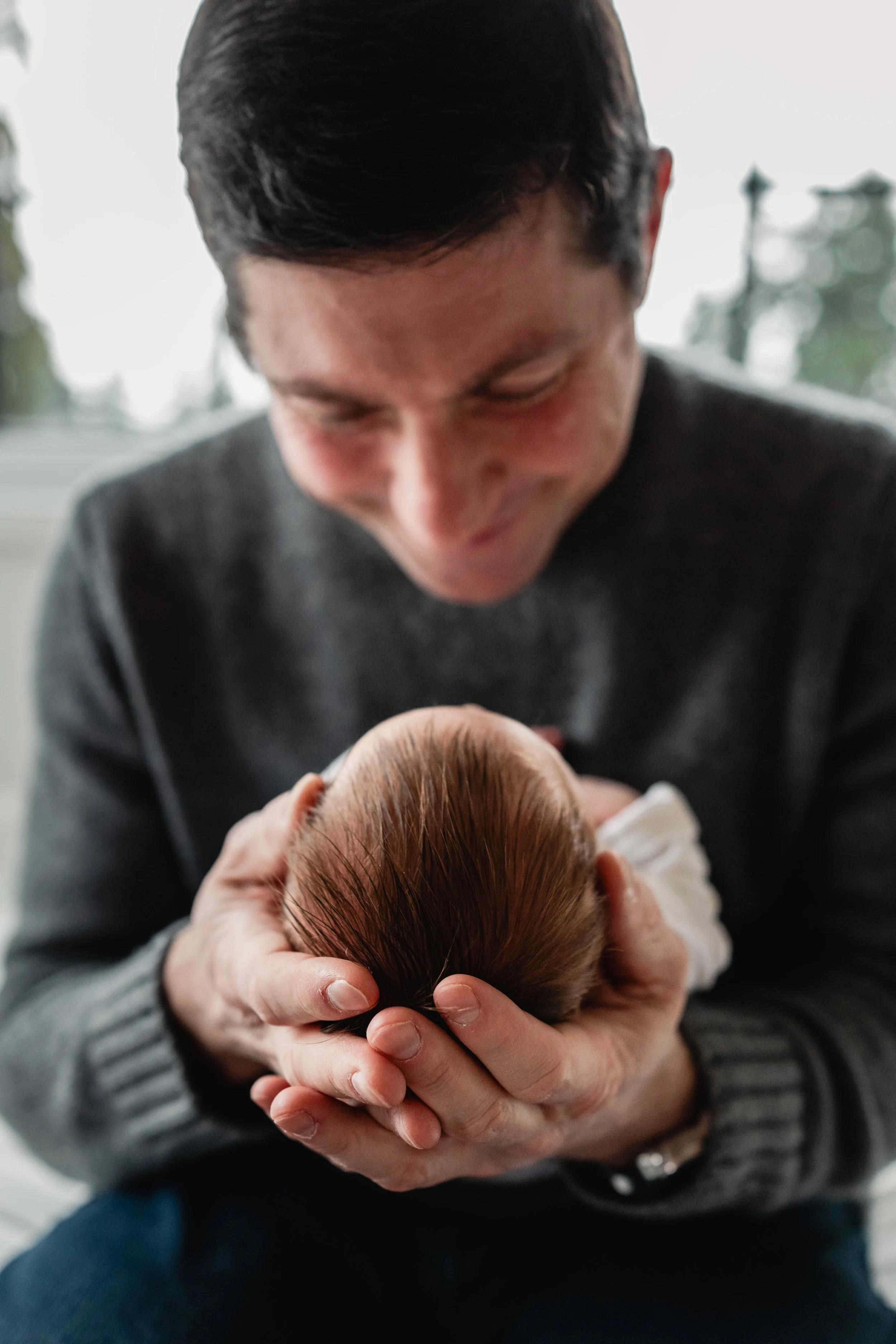 Seattle dad poses with newborn baby