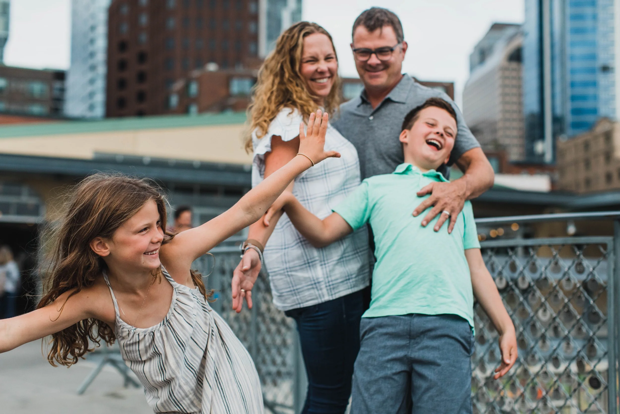 Seattle family photography, Pike Place Market, playful family moments, candid kids photography, downtown Seattle skyline.