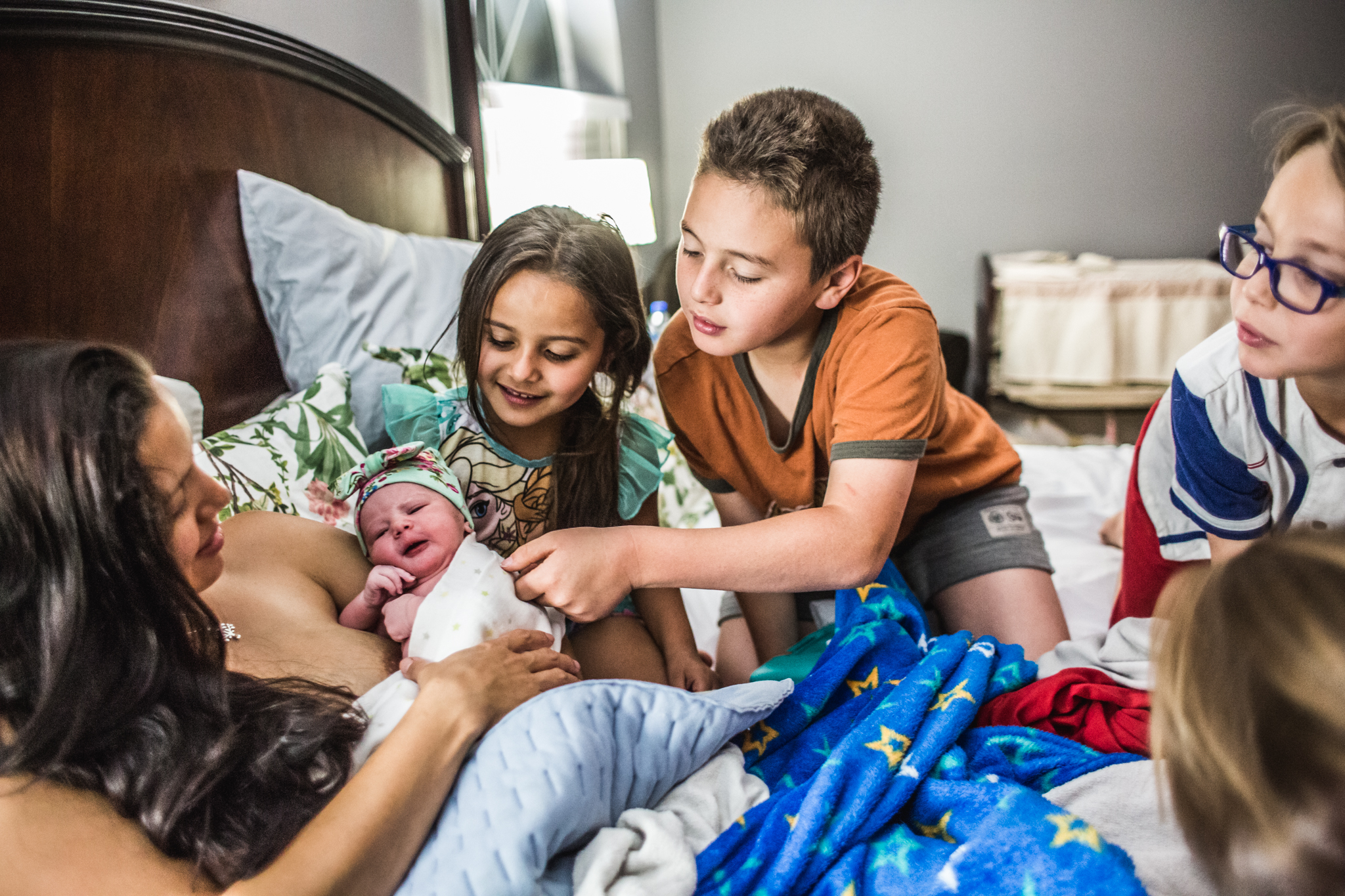brothers and sisters meet newborn baby girl after birth at home loxahatchee palm beach county 2.jpg