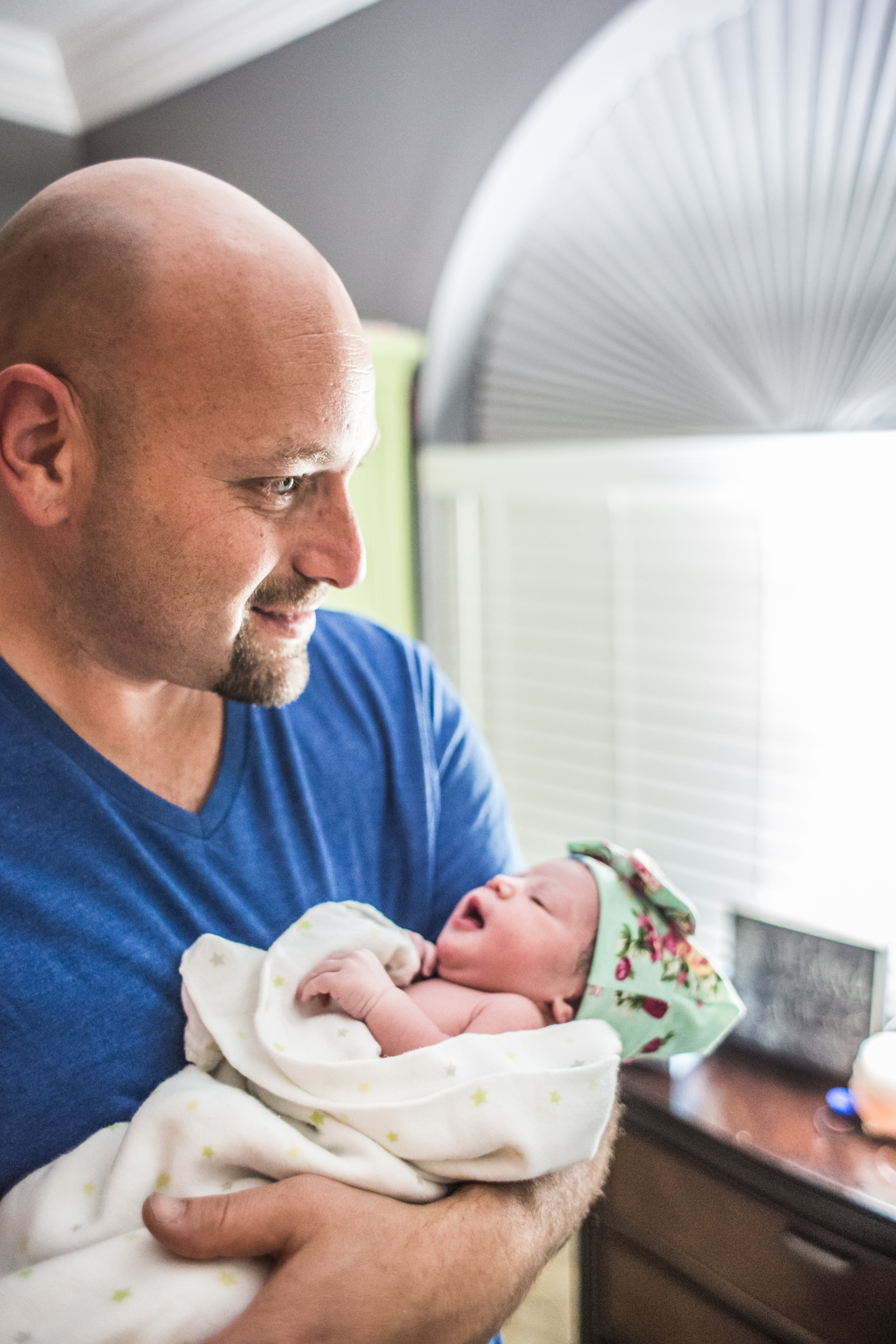 dad holding newborn baby girl after home birth in palm beach county paulina splechta birth photographer gelena hinkley midwife sandy lo assistant midwife .jpg