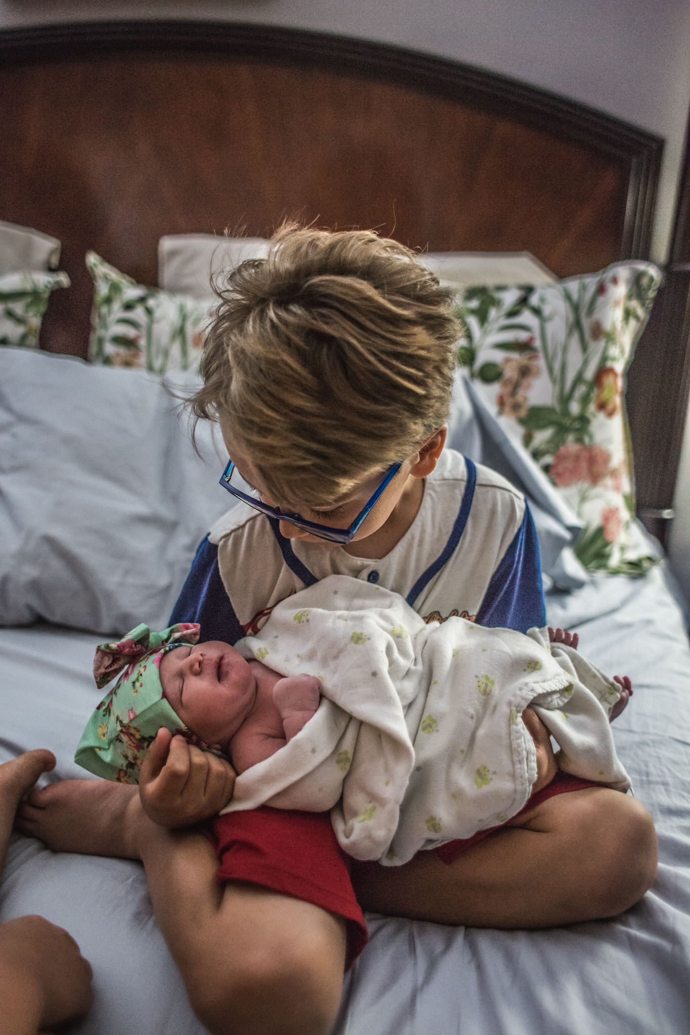 dad holding newborn baby girl after home birth in palm beach county paulina splechta birth photographer gelena hinkley midwife sandy lo assistant midwife 8.jpg