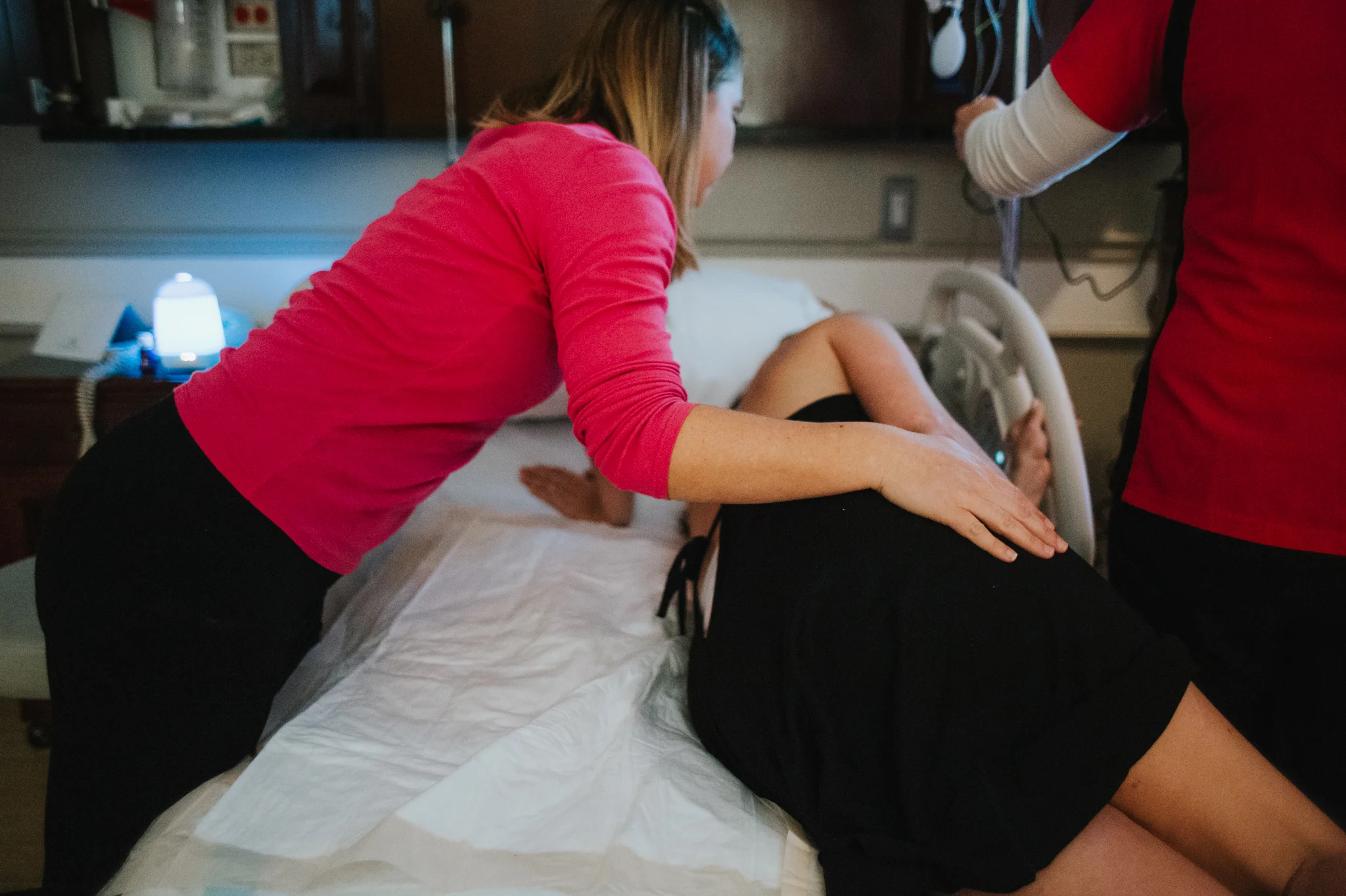 Orchid Nest doula Samara supporting a mom during her labor at Boca Raton Regional Hospital.