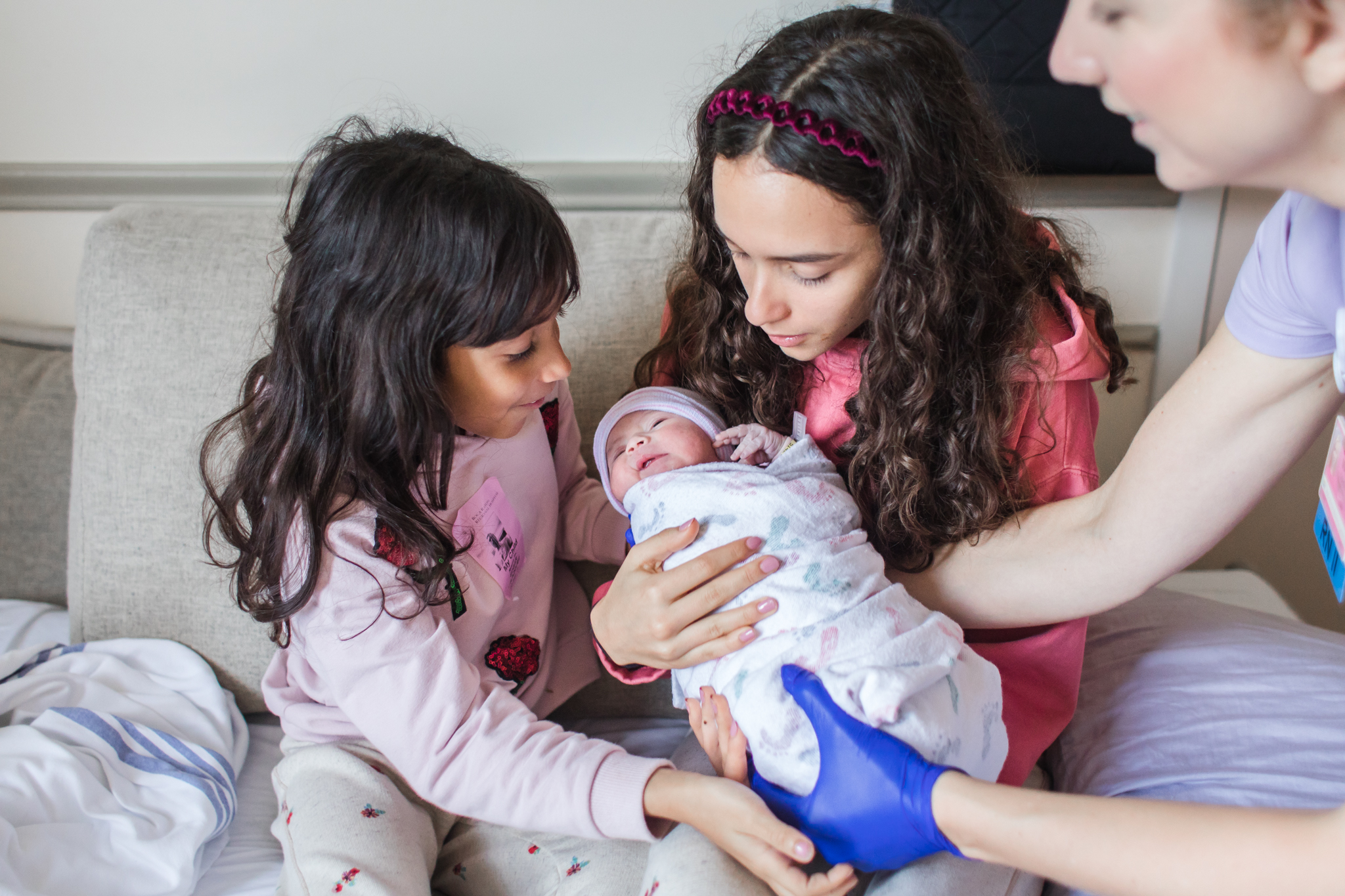 kids holding baby hospital birth.jpg