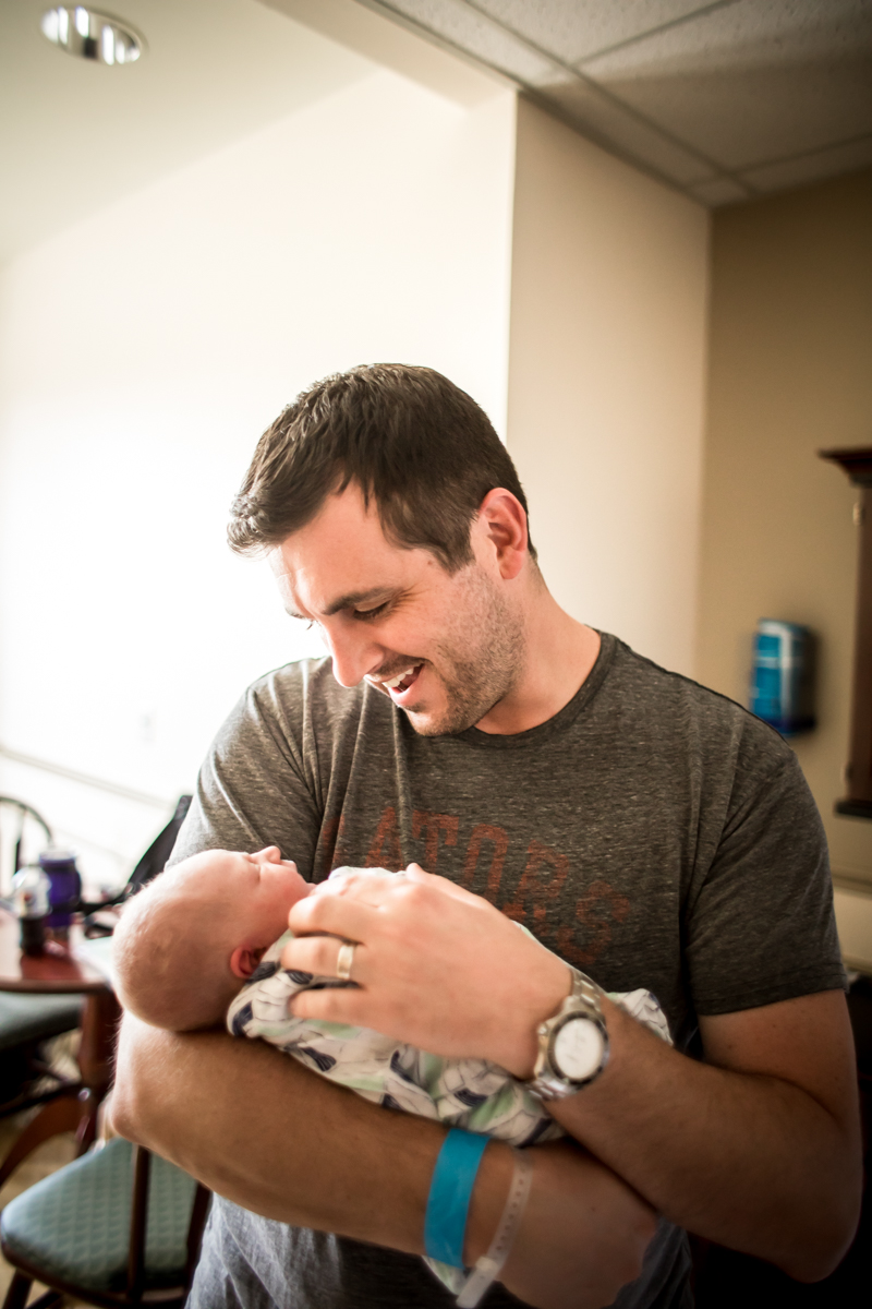 dad holding baby in the hospital.jpg