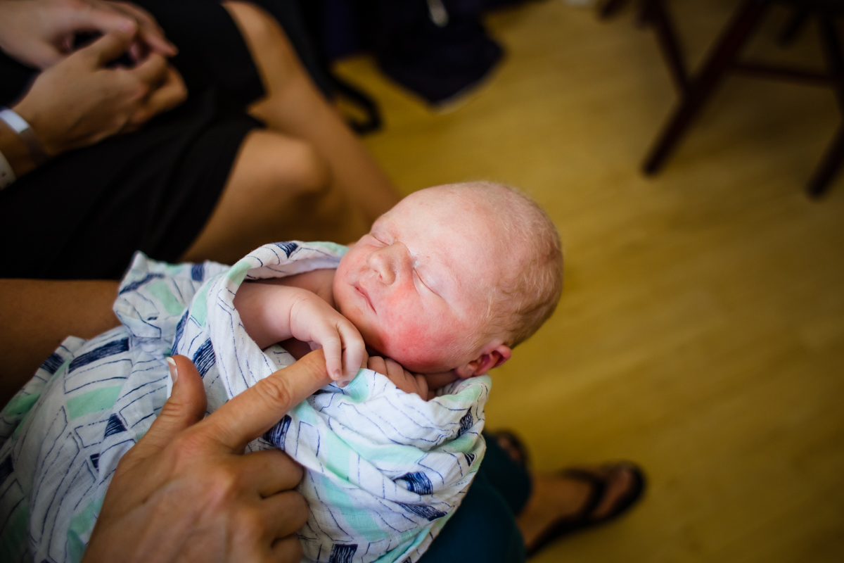 newborn holding finger.jpg
