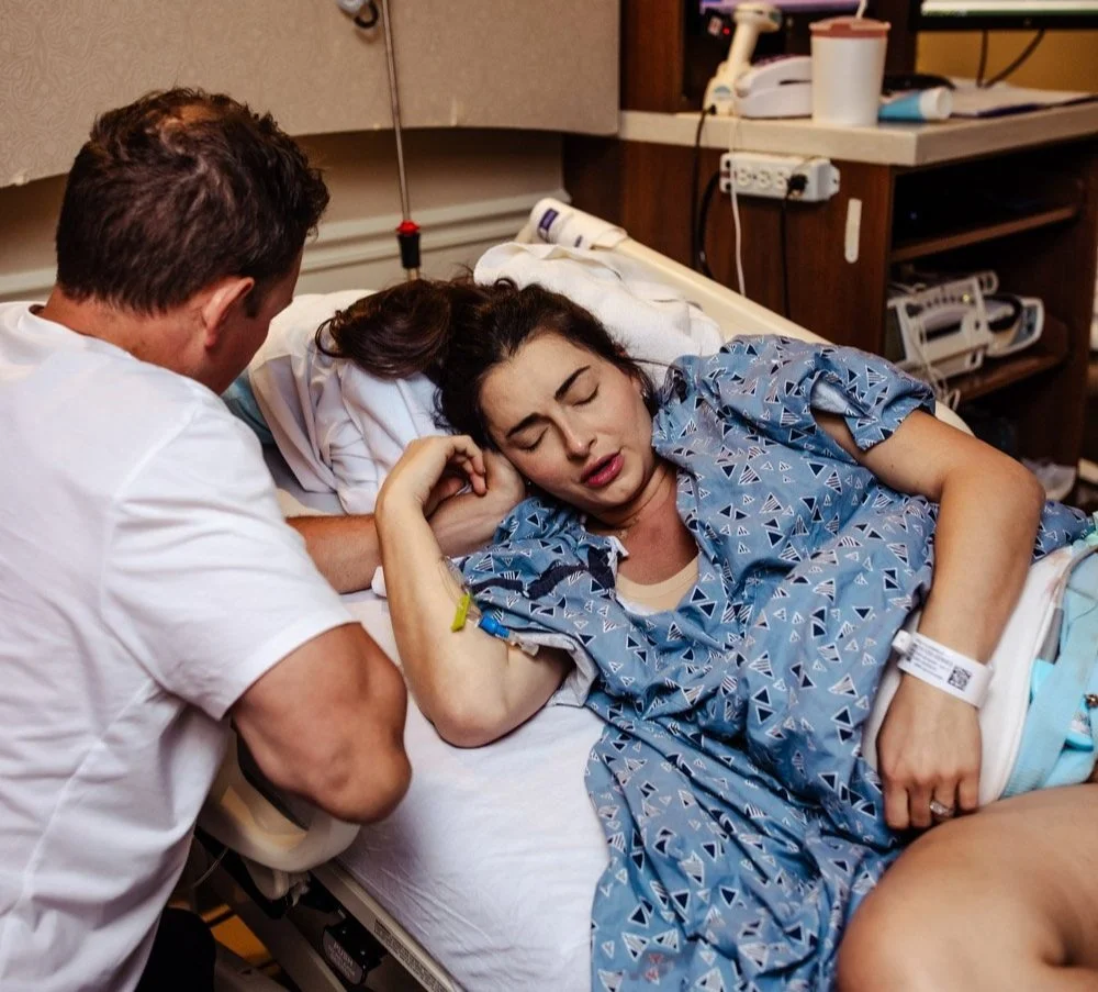 laboring woman side lying during contractions in hospital bed of boca regional