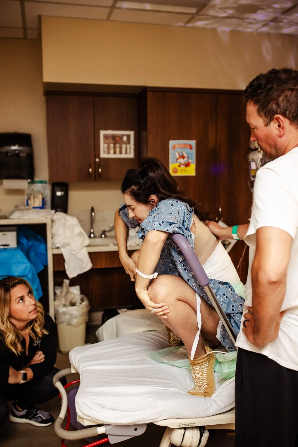 laboring woman uses squat bar to labor her baby down during vbac at boca raton hospital in labor and delivery unit