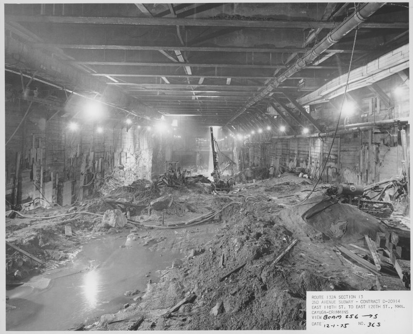 Photograph documents (1975) construction on the Second Avenue Subway. View of tunnel looking South from beam 256, 12/1/1975 ( Courtesy of New York Transit Museum ). Click here to see more photograph documents from 1975 .