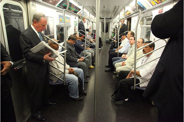New York City Mayor Michael Bloomberg reads one of his newspapers during his subway ride to City Hall in this file photo taken in 2002. He is public transportation’s loudest cheerleader, boasting that he takes the subway “virtually every day.” He has told residents who complain about overcrowded trains to “get real” and he constantly encourages New Yorkers to follow his environmentally friendly example. Bloomberg has said that he is energized by the city's tough fiscal times and in fact that he probably wouldn't even want to govern a prosperous city. (AP Photo/Richard Drew)
