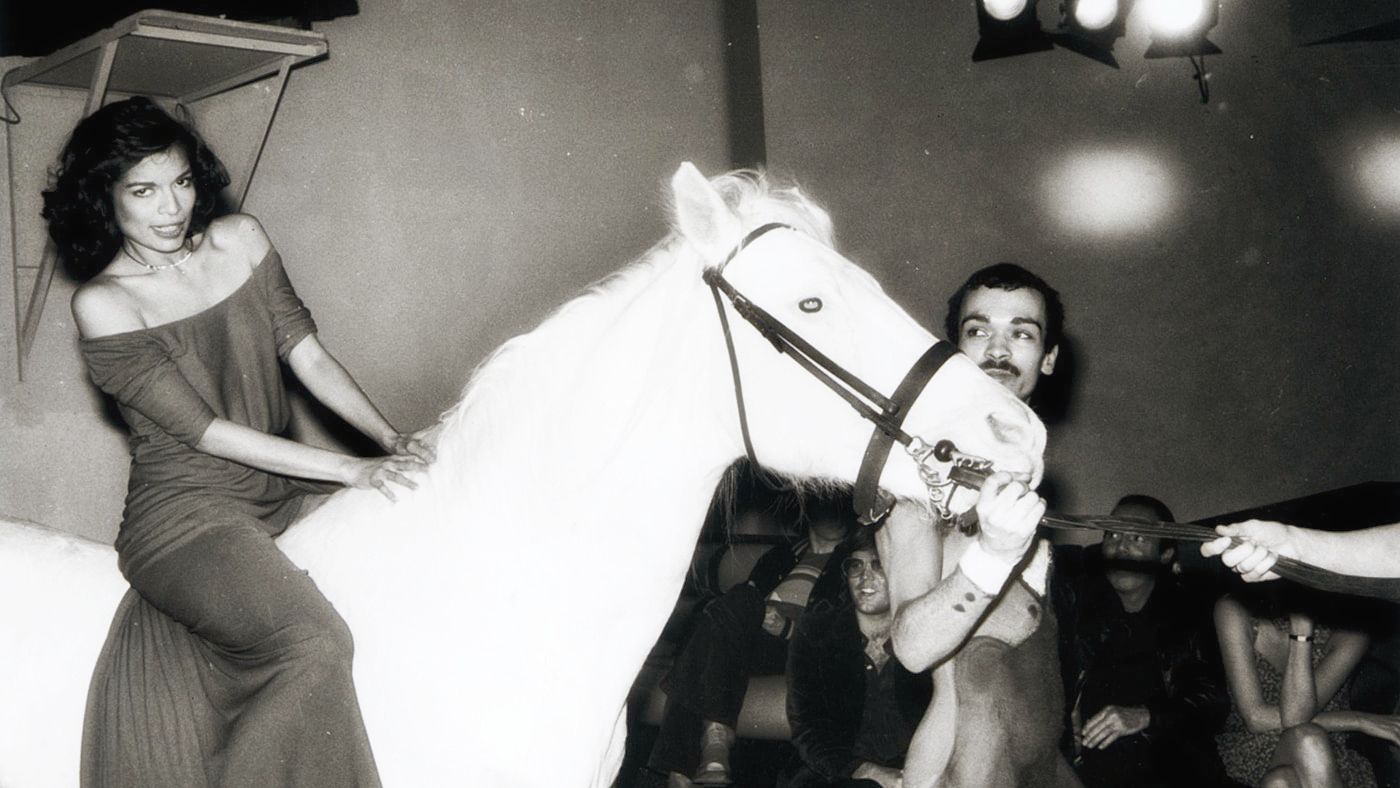 Bianca Jagger ride a white horse into the club for her 30th birthday party. Credit: Hasse Perrson