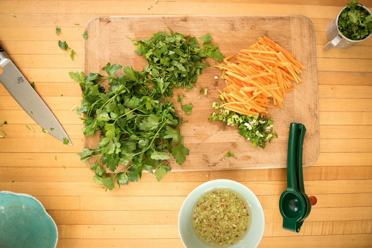 Carrots, herbs, and dressing prepared for Umi Organic fresh ramen noodles