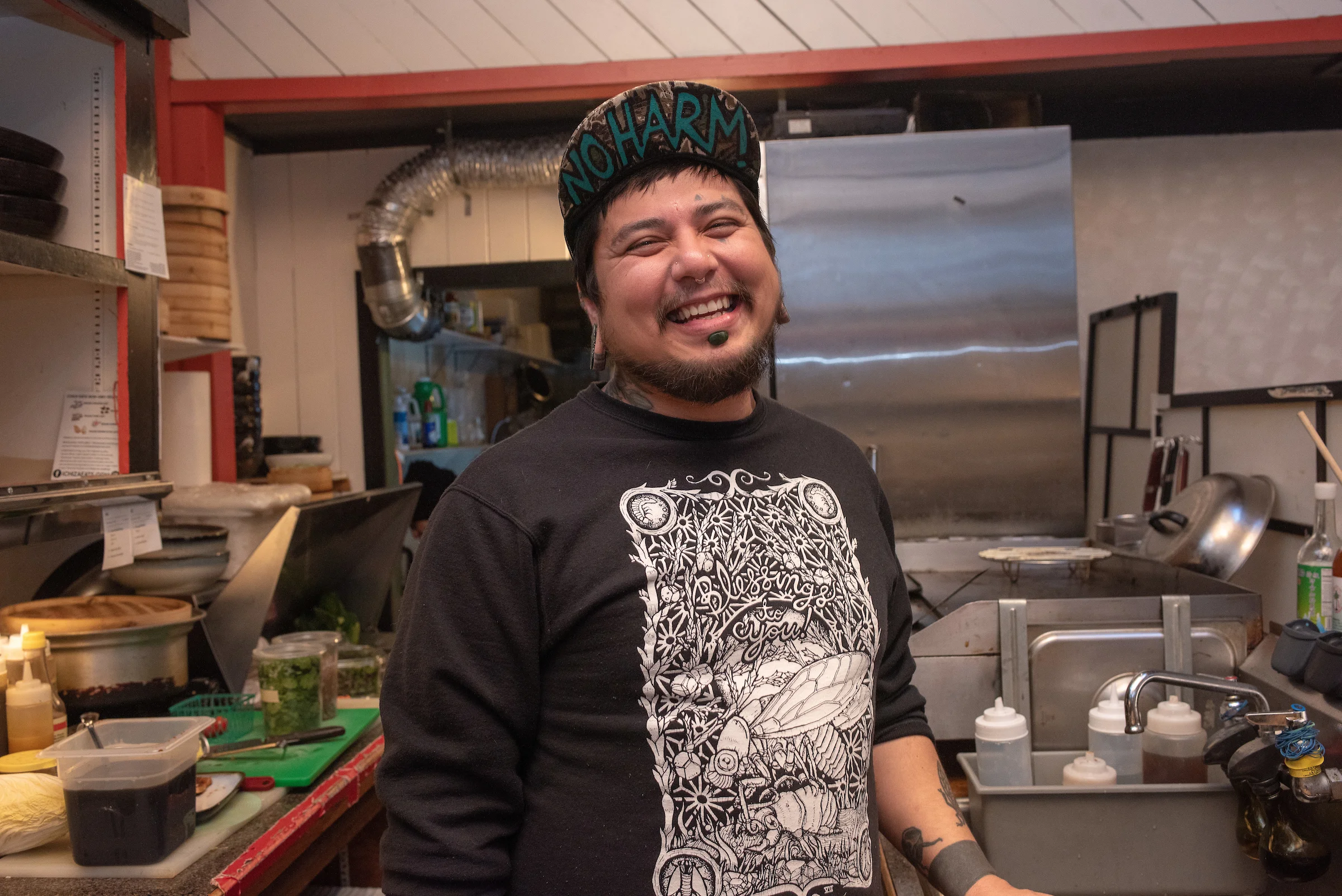 Cyrus Ichiza in the kitchen by Shawn Linehan .