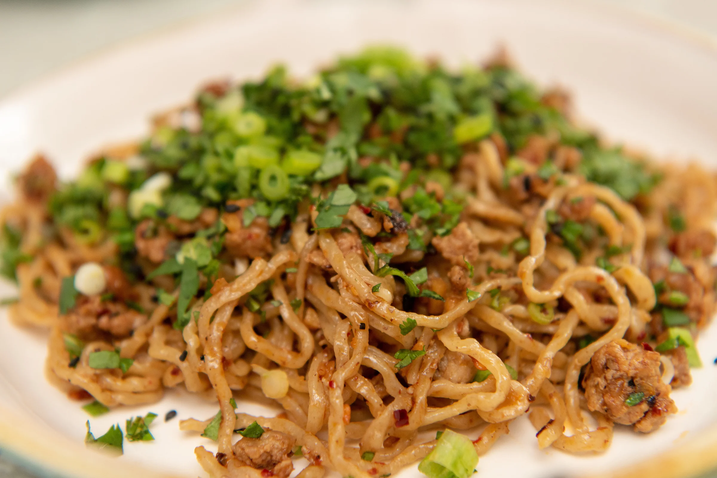 Nikki Guerro of Hot Mama Salsa and Chile Oils cooks an umi noodle dish