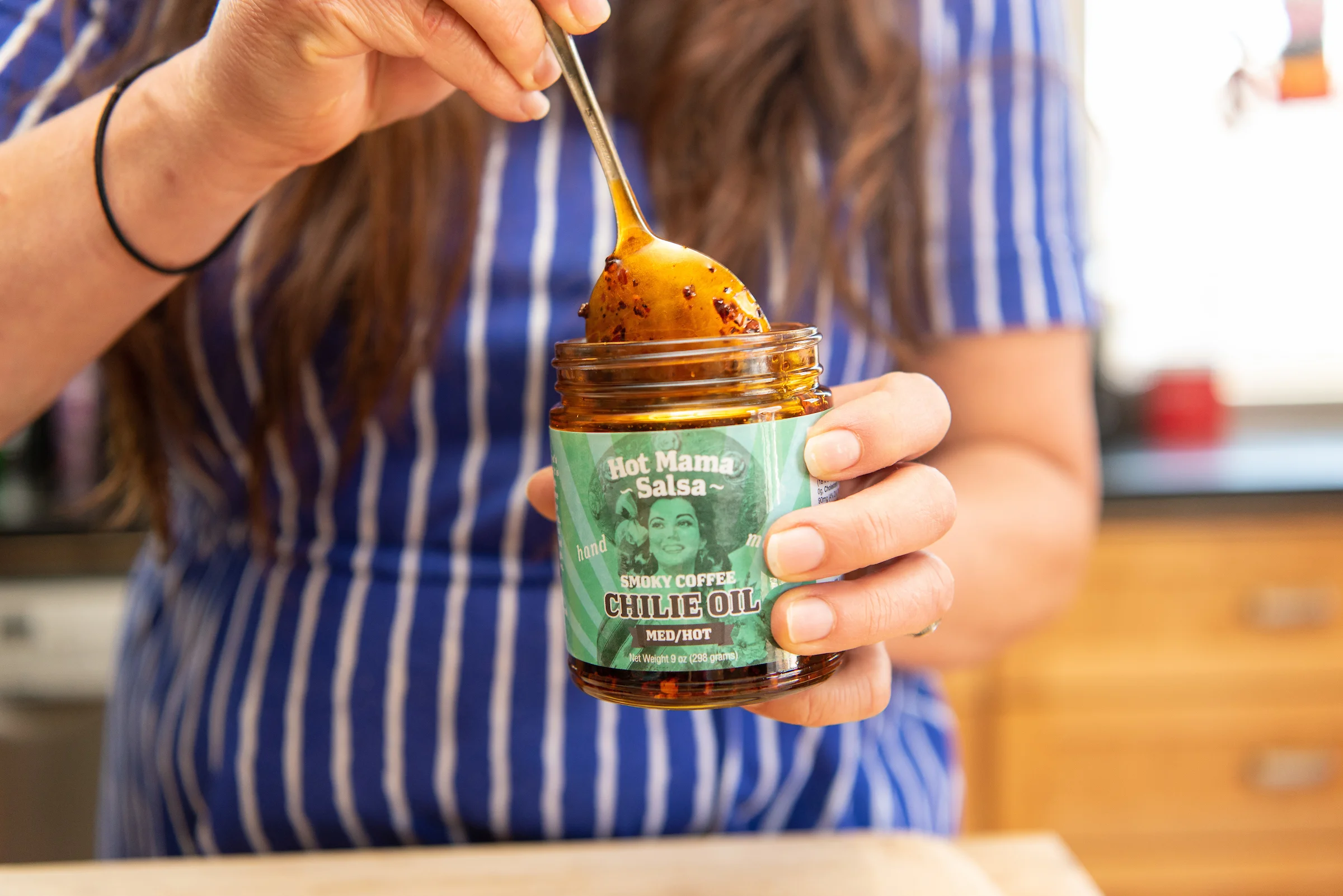 Nikki Guerro of Hot Mama Salsa and Chile Oils cooks an umi noodle dish