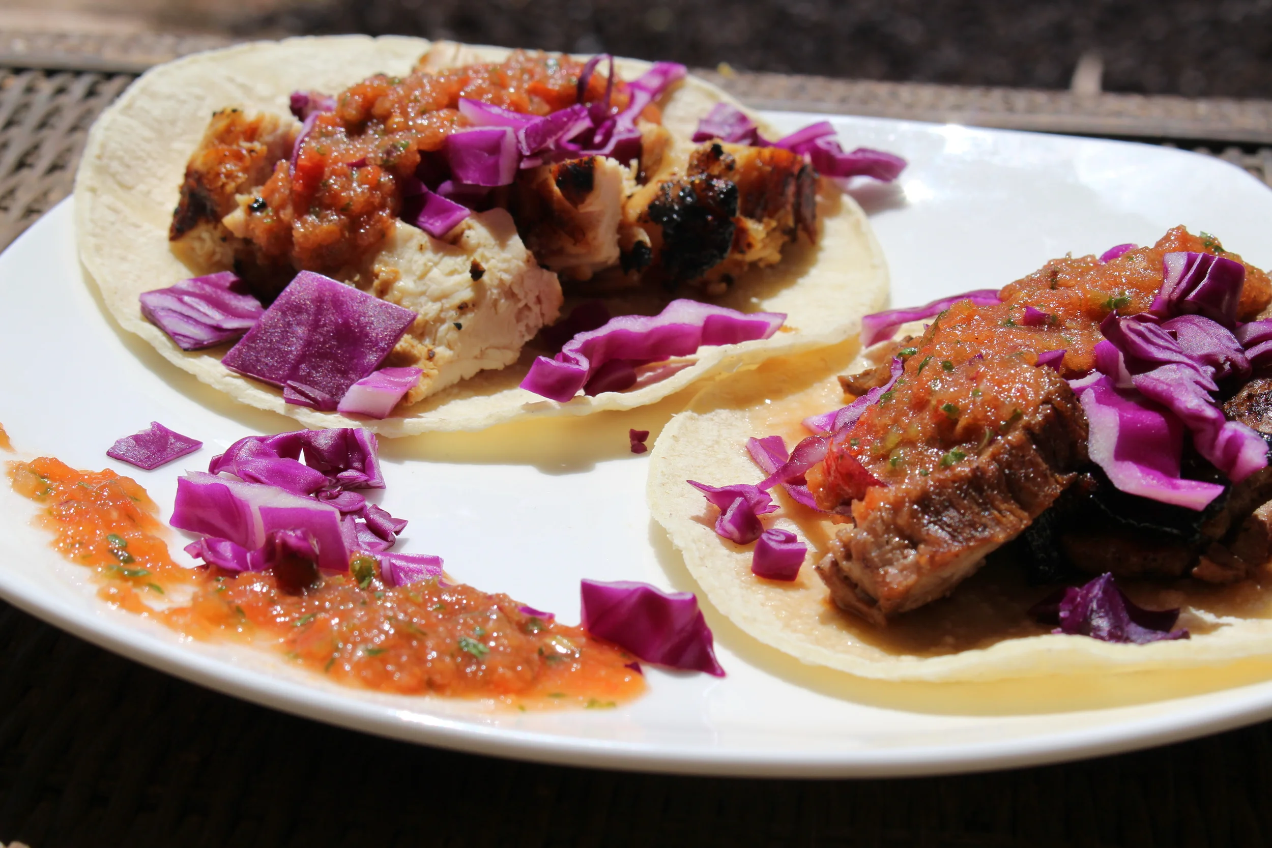 Corn tortillas with carne-asada, purple cabbage and fresh salsa! 