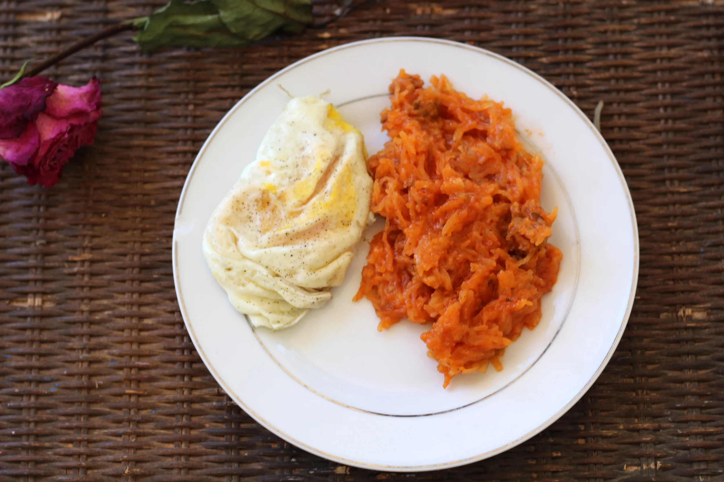 Breakfast: Overeasy Eggs and Spaghetti Squash Greatness! (Tomato paste and Sausage added)