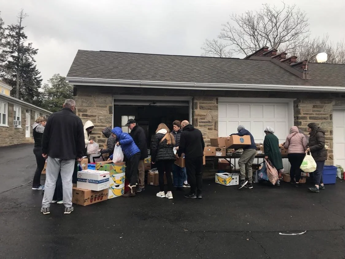 JFC volunteers preparing groceries for neighbors