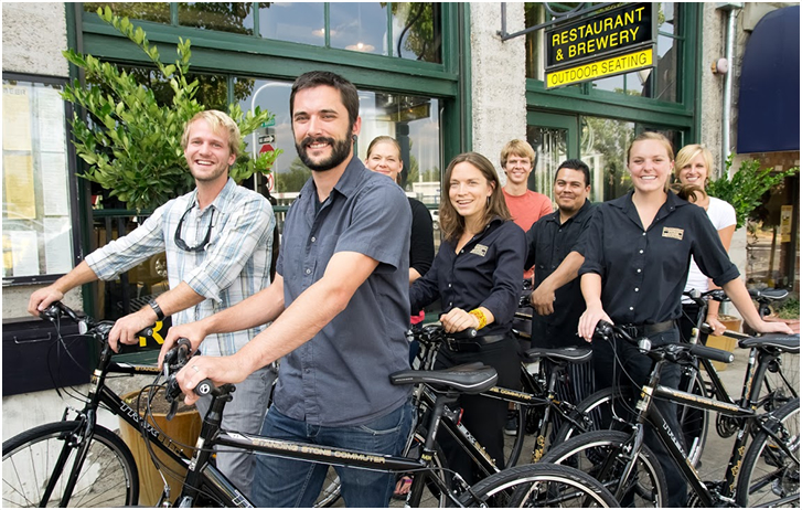 Employees of standing stone brewery with commuter bikes