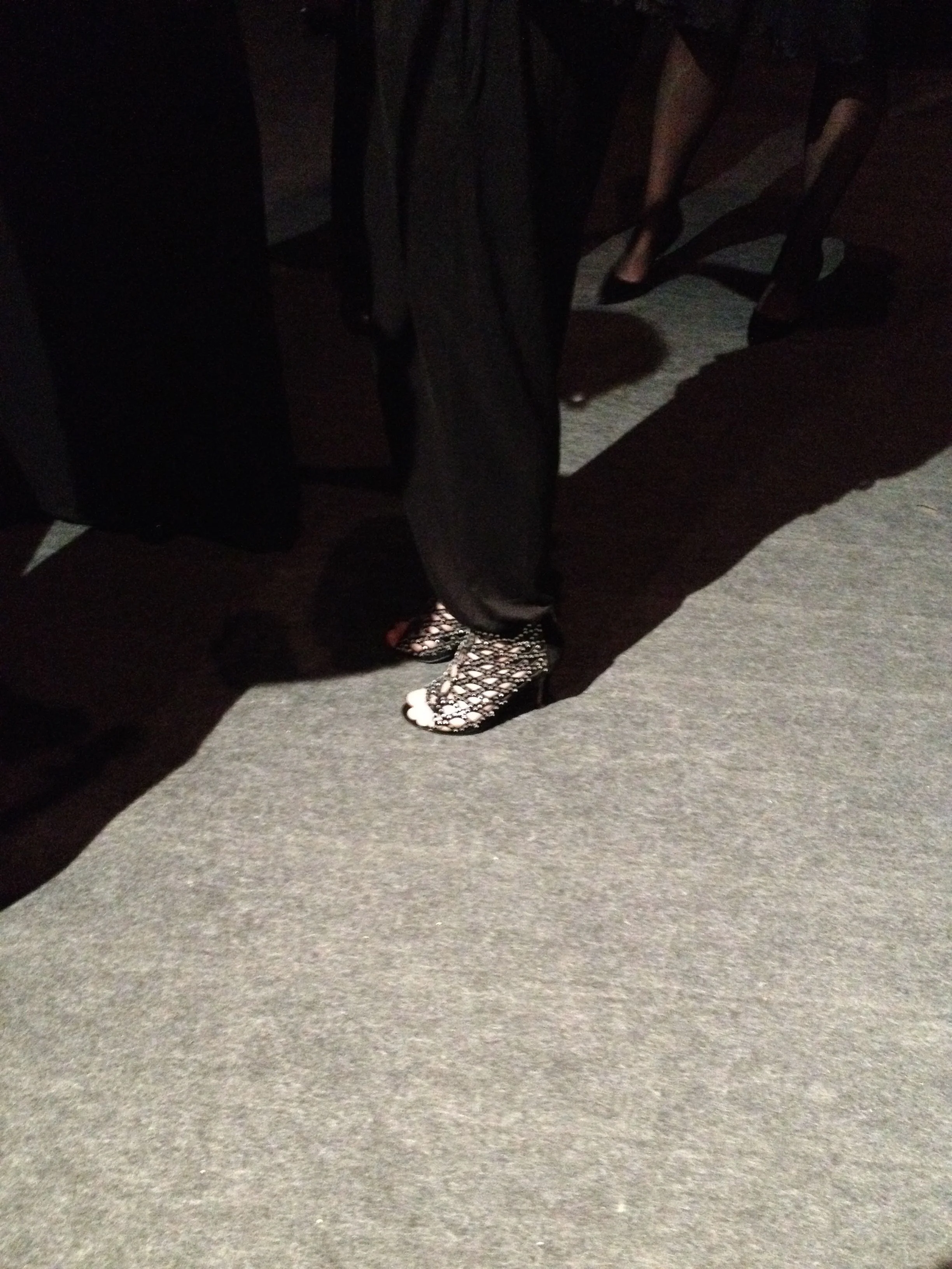 A Bill Cunningham moment backstage in Lisbon: shoes with attitude!
