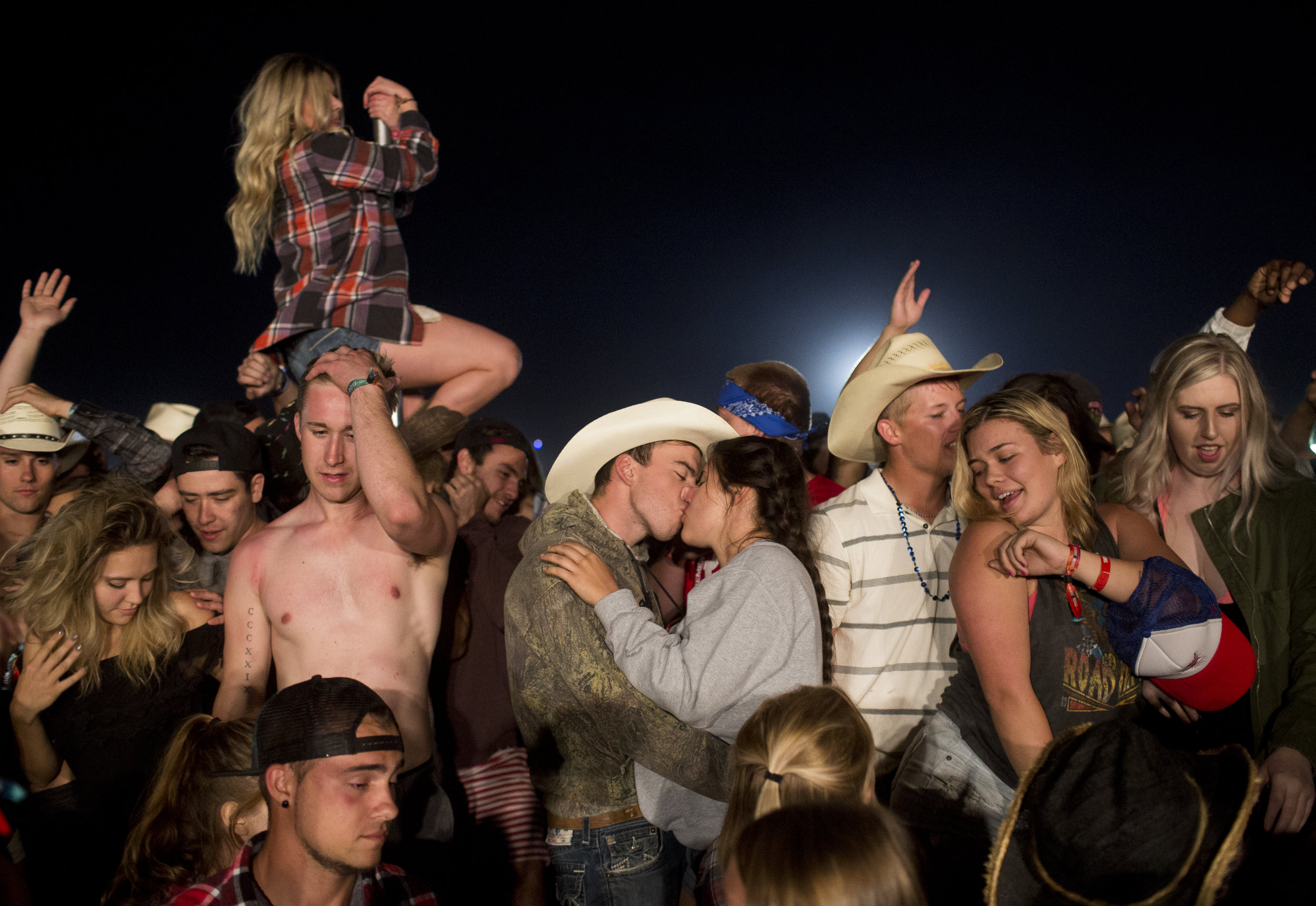  Festival-goers party in the after hours at the Country Thunder Music Festival, in Florence, Ariz.  