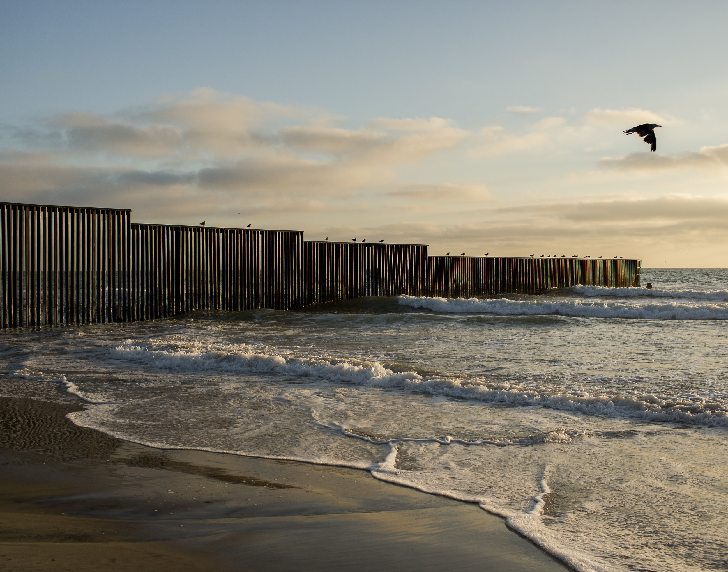  The border fence between the United States and Mexico ends at the ocean in San Diego, California.  