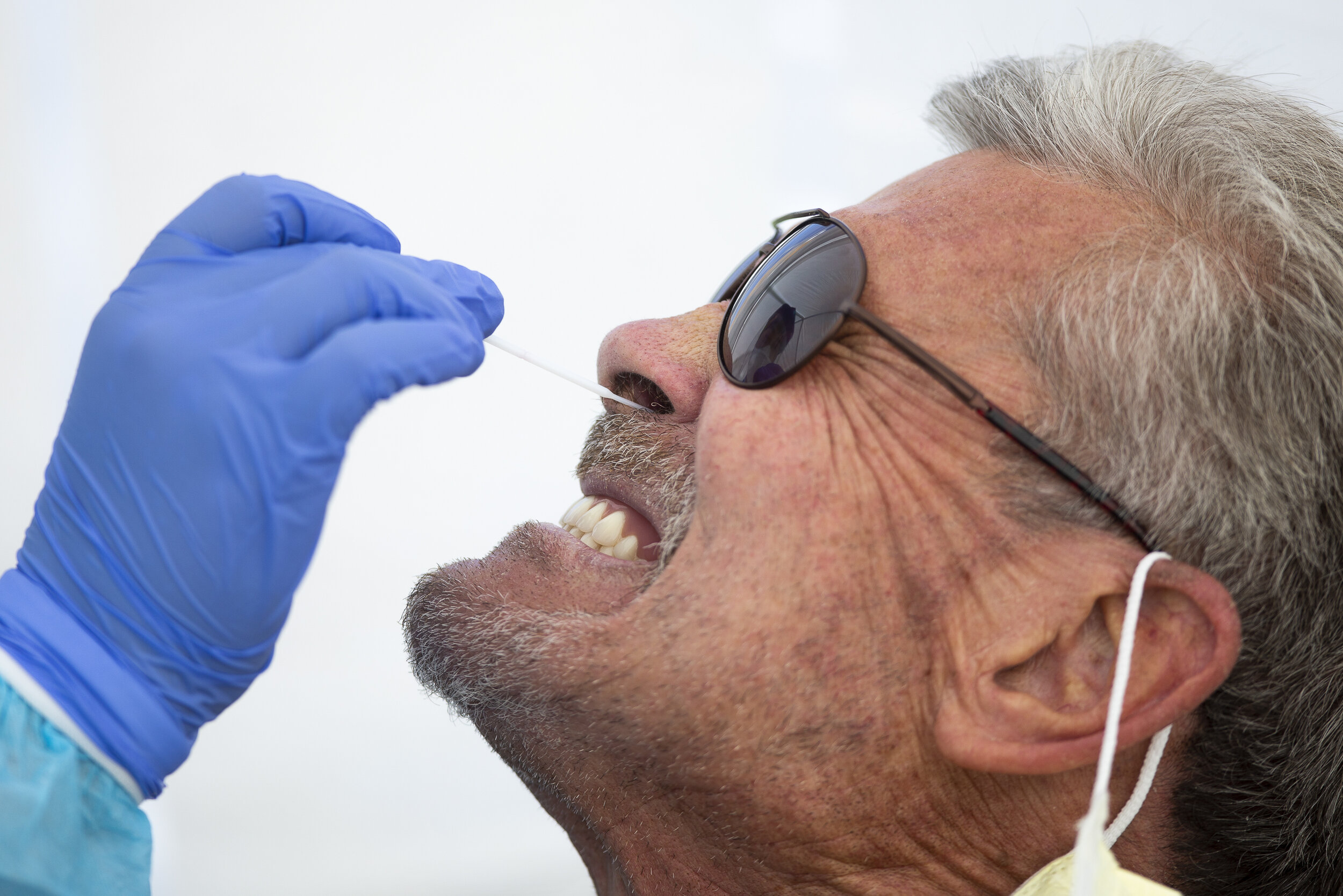  Truck Ridgeway (right) receives a COVID-19 test at Native Health in Phoenix, Ariz. on May 16, 2020. 