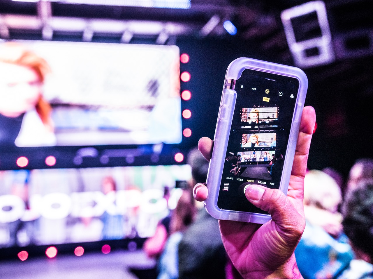 An attendee records the video inspiration.