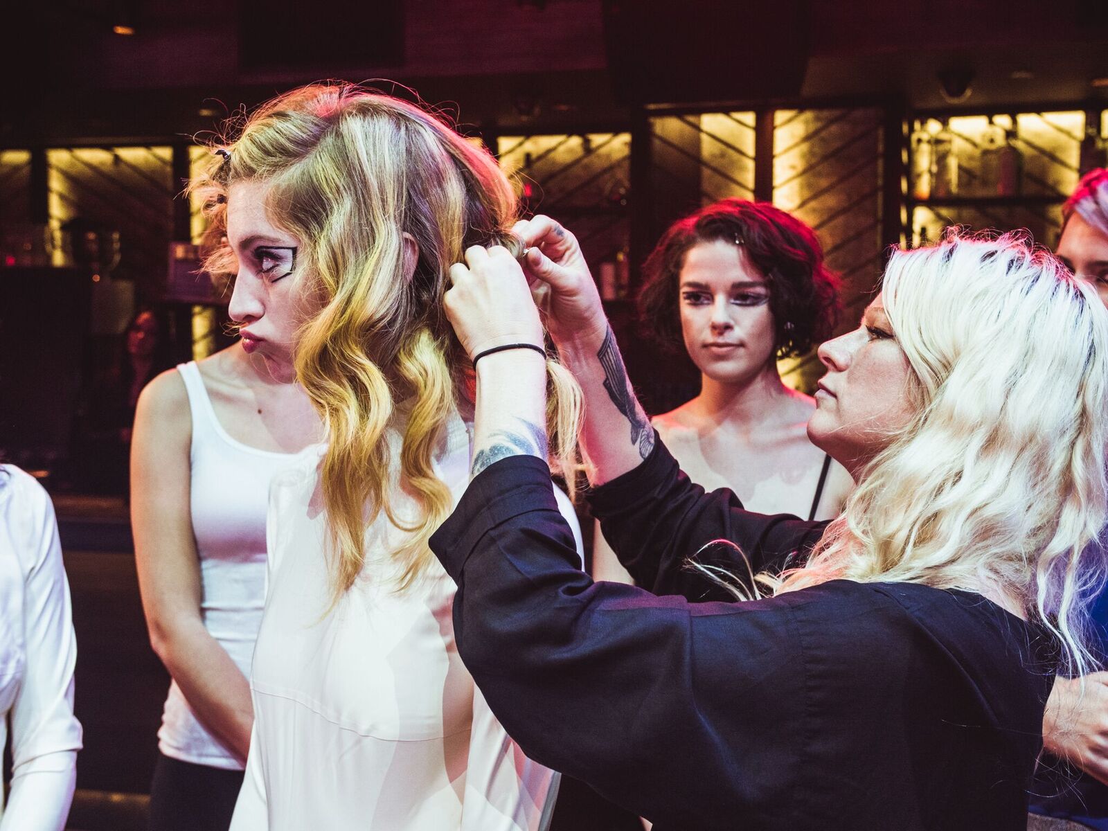 ARROJO master stylist Amanda Jenkins adds the final touches behind the scenes at the Expo party and presentation.