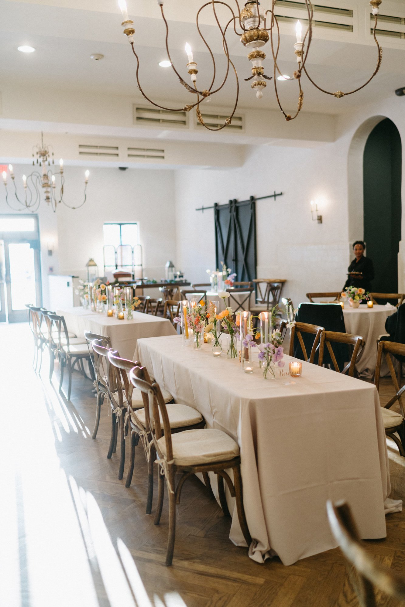 Wedding reception tables arranged inside the venue.
