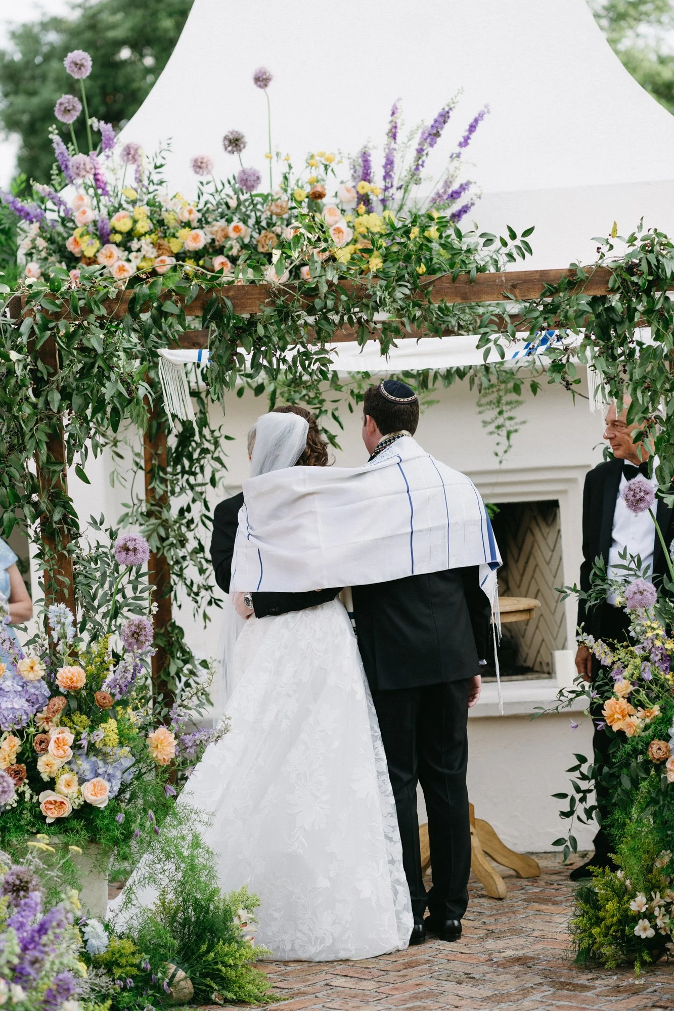 Missy and Alec standing together during the wedding ceremony.