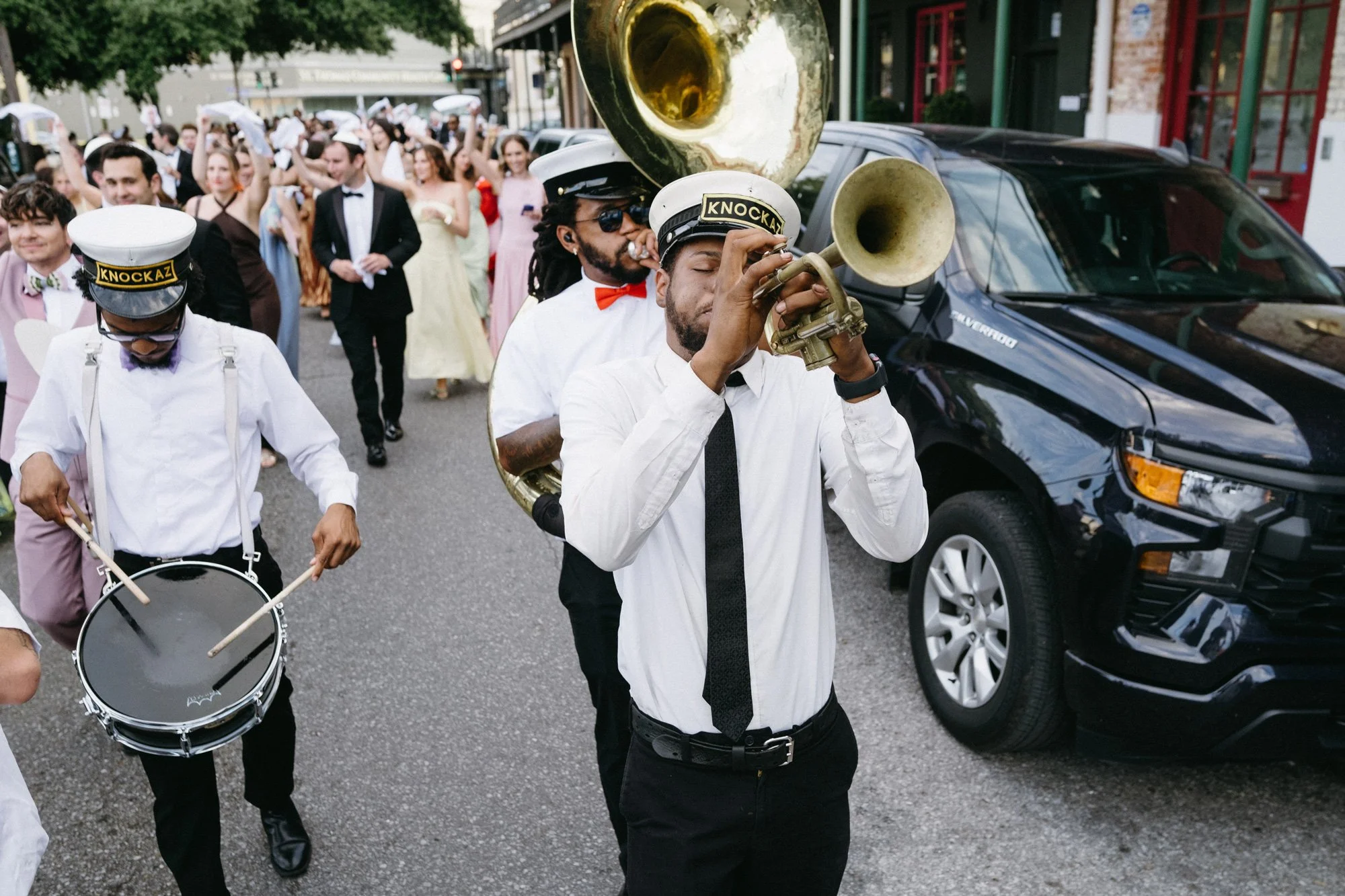 Brass band musician performing during the wedding celebration.