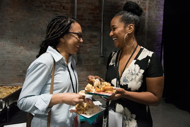 People enjoying the meal served by Elysian Seafood at New Orleans Entrepreneur Week. Photo by Monwell Frazier .