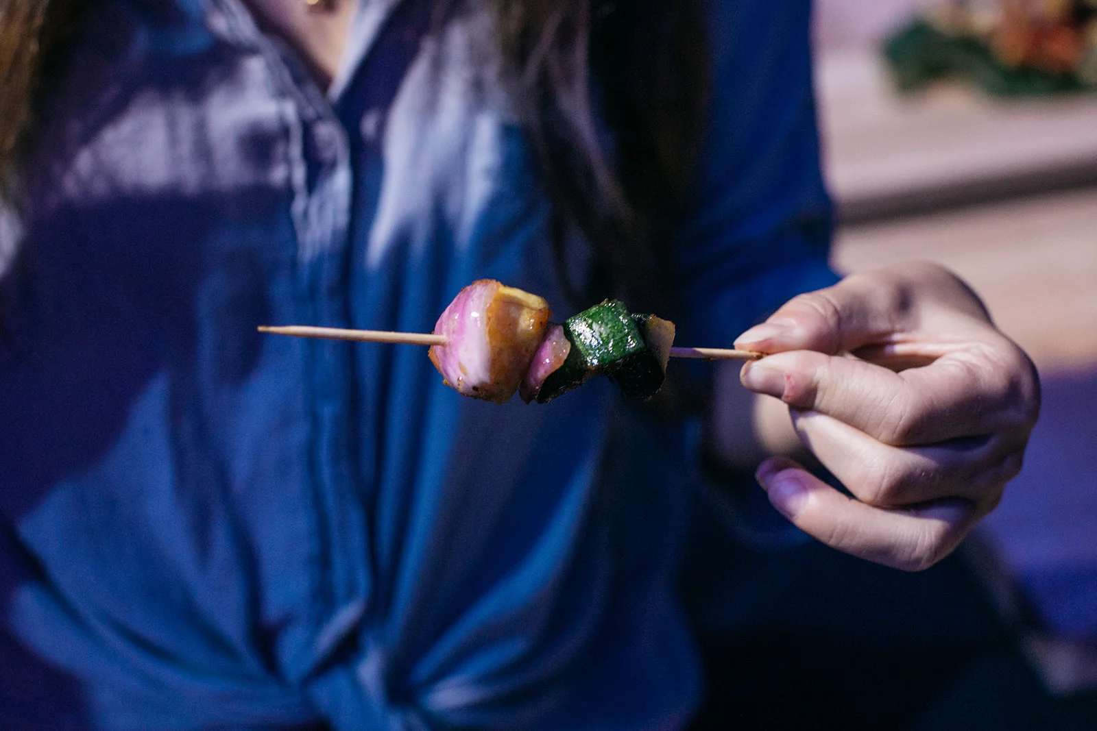 A guest with a skewer. Photo by Ollie Alexander.