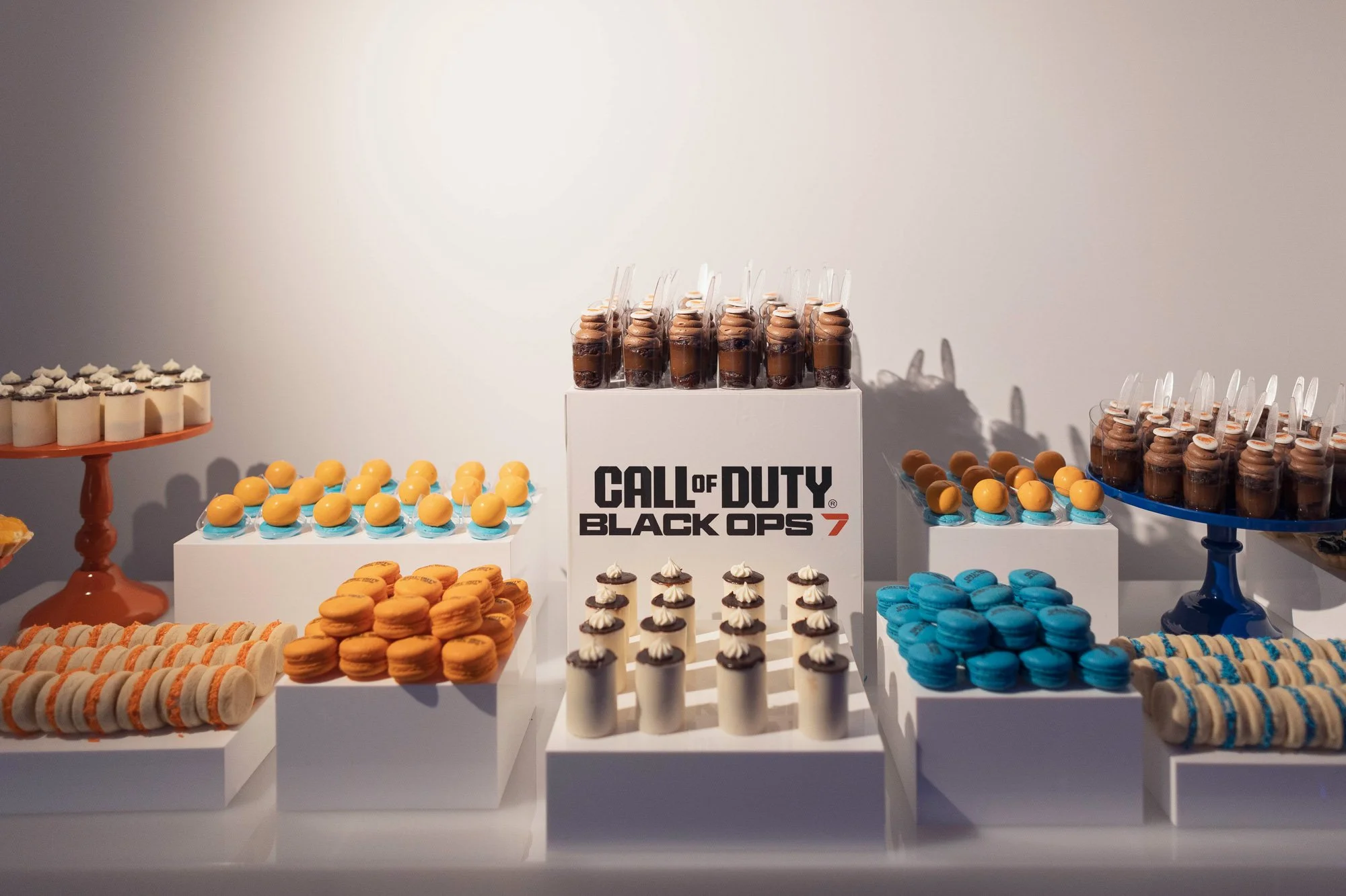 Custom dessert display featured sweets, colorful confections, and bite-sized treats created exclusively for the Black Ops 7 event.