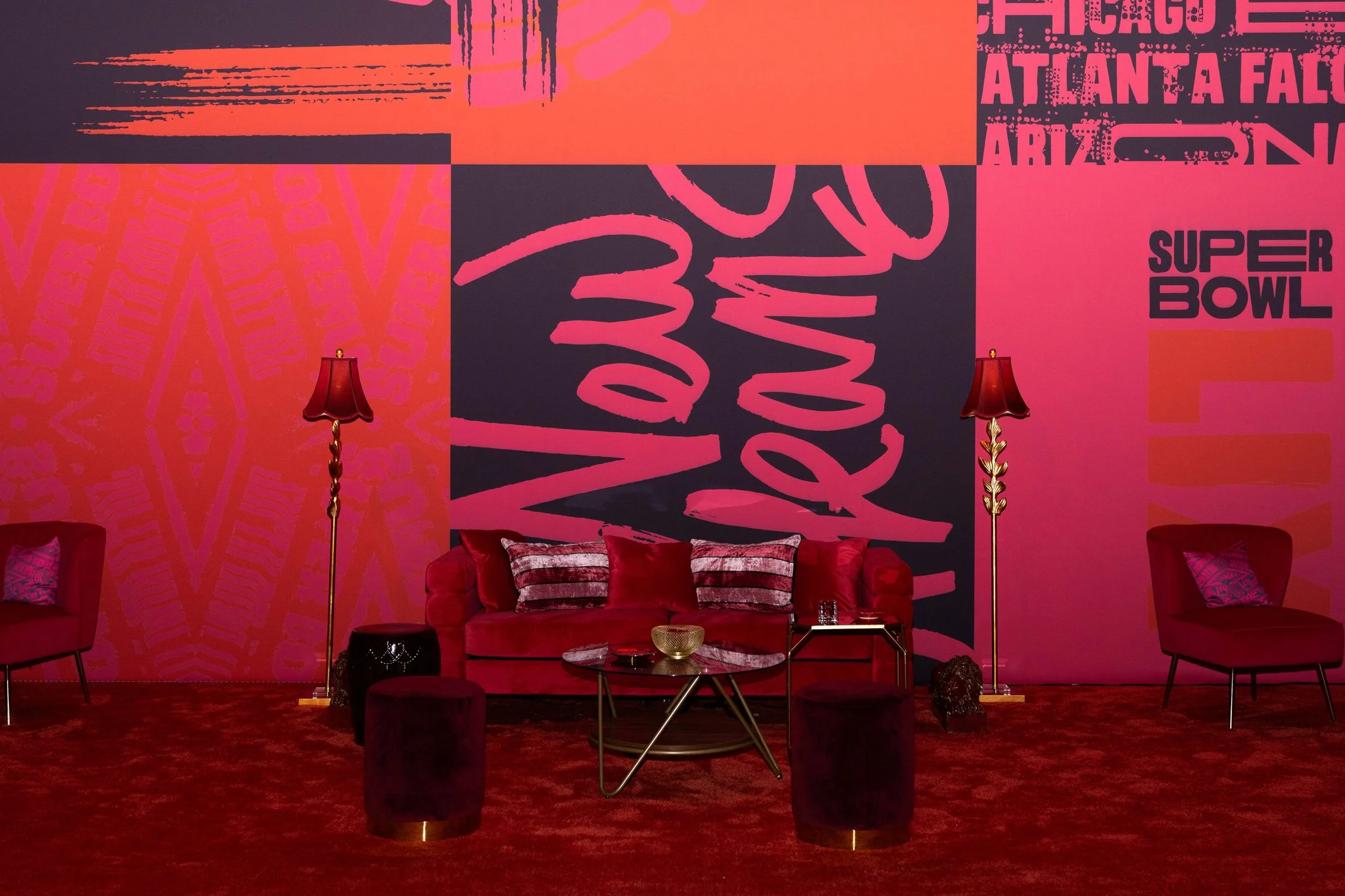 Lounge seating surrounded by colorful Super Bowl LIX décor.