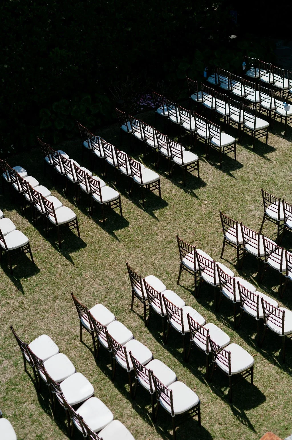 Outdoor wedding ceremony setup with rows of chairs