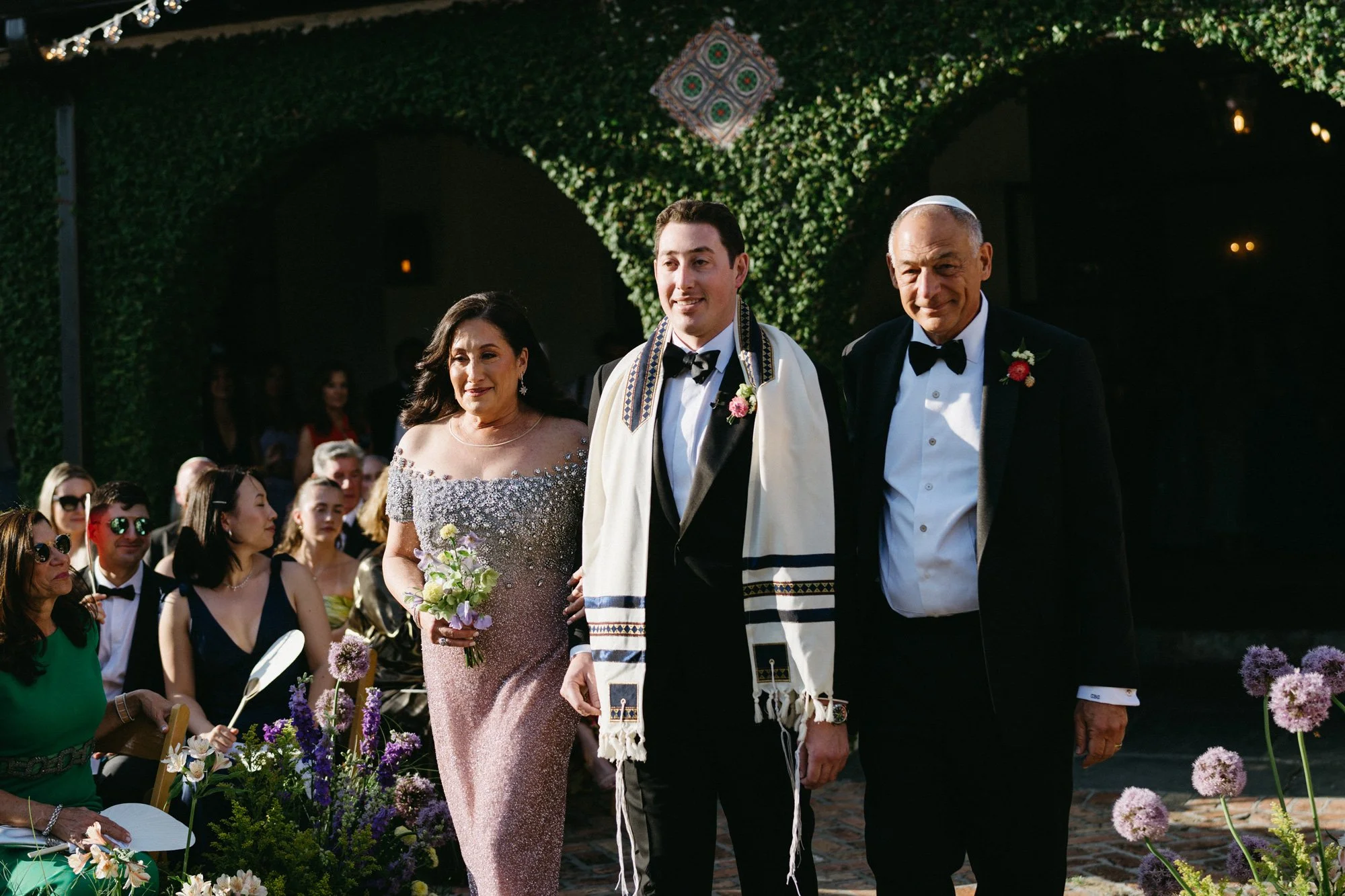 Groom walking down the aisle.
