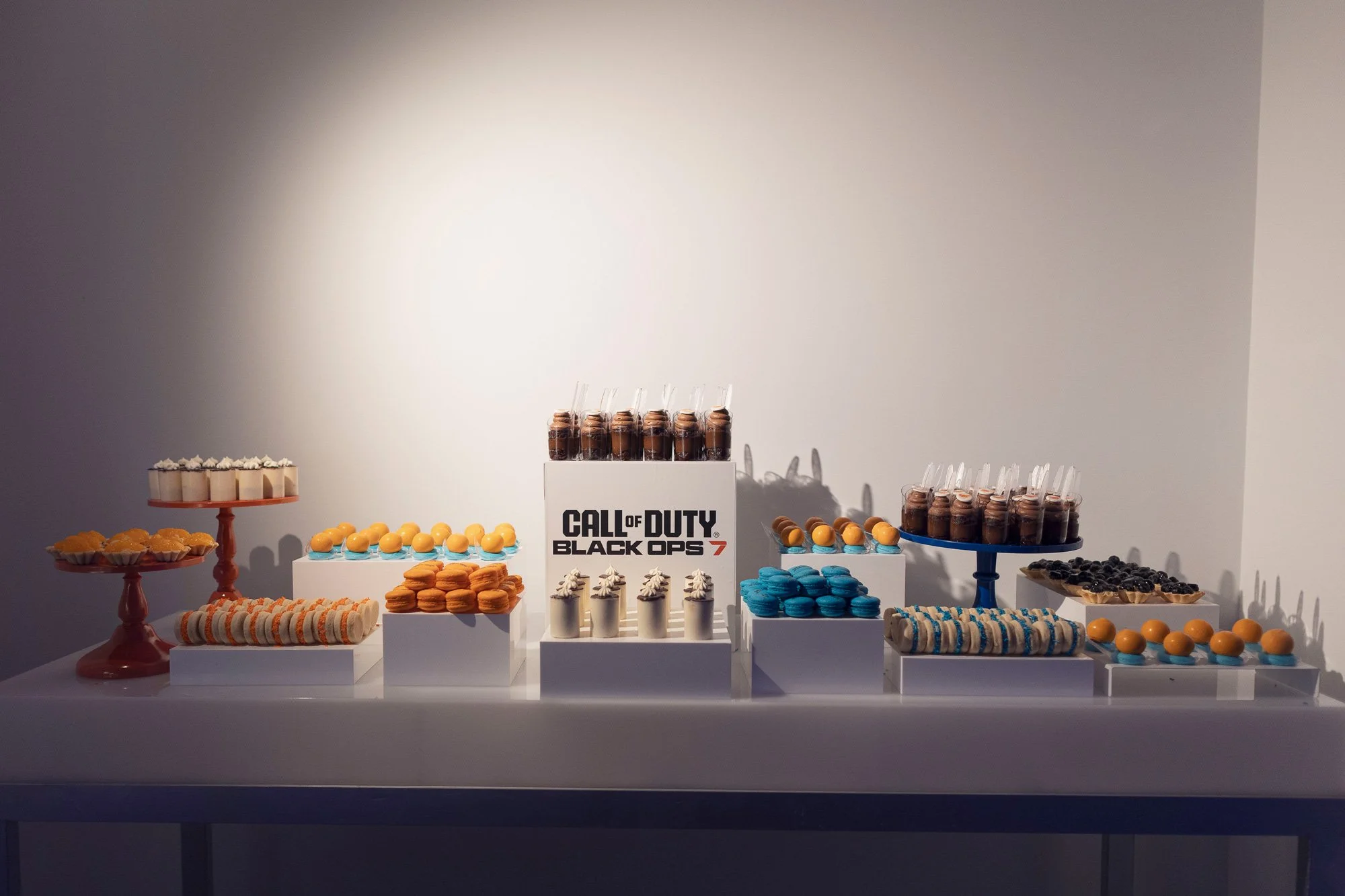 A dessert station combined custom presentation, themed colors, and a curated selection of handcrafted desserts for guests to enjoy throughout the evening.