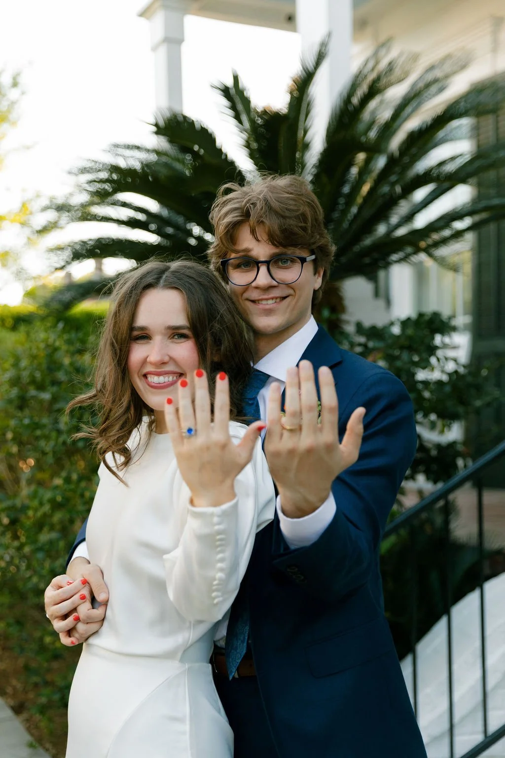 Brooke and Niels showing their wedding rings.