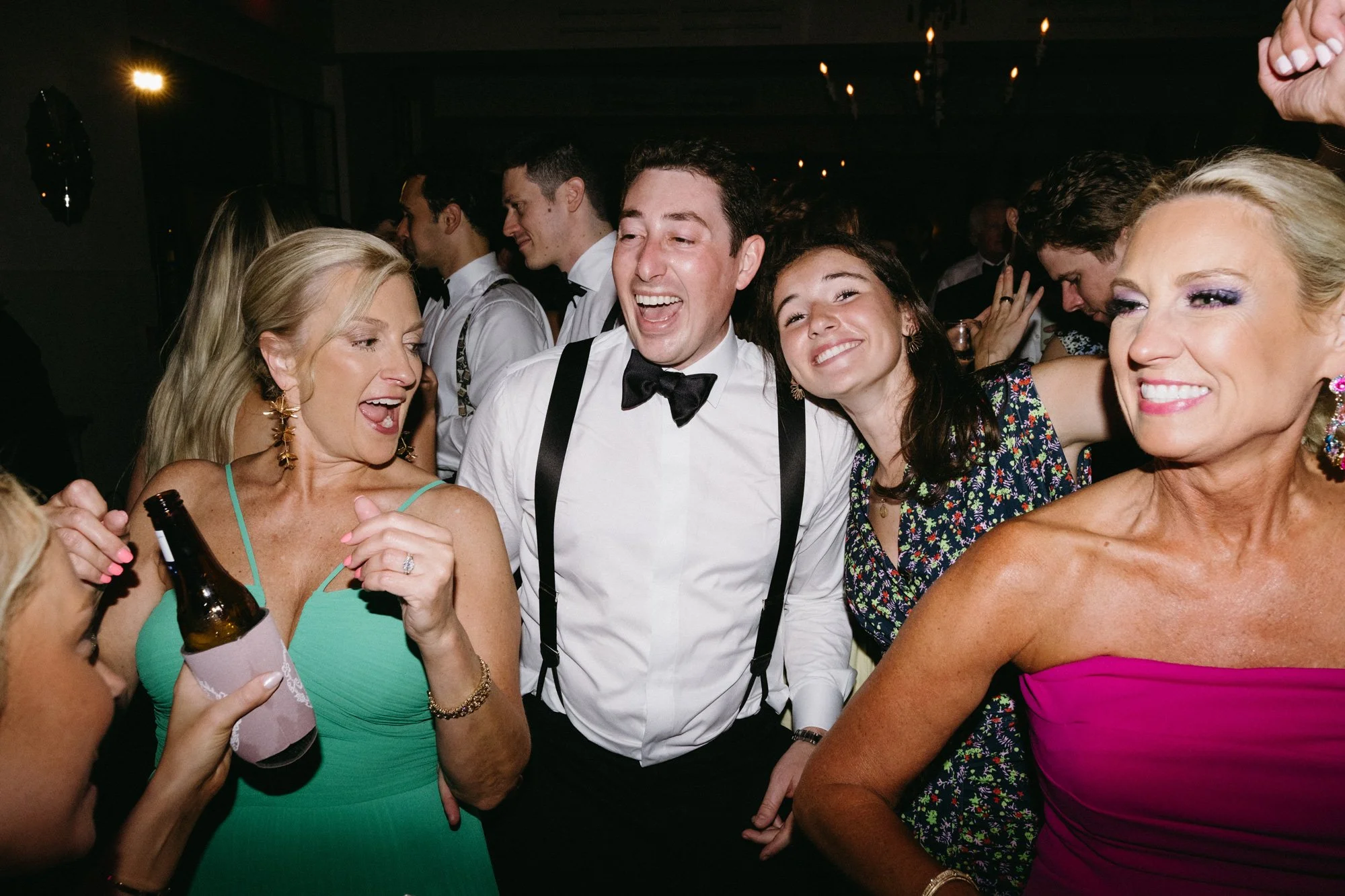 Alec celebrating with guests on the dance floor.