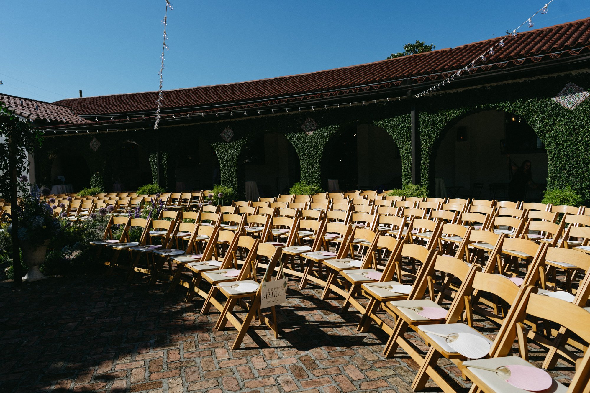 Rows of chairs arranged for the courtyard ceremony.