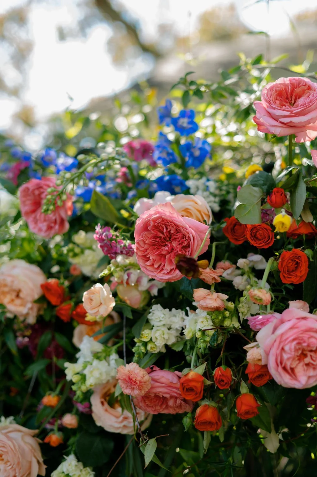 Vibrant wedding florals in pink, blue, yellow, and orange.