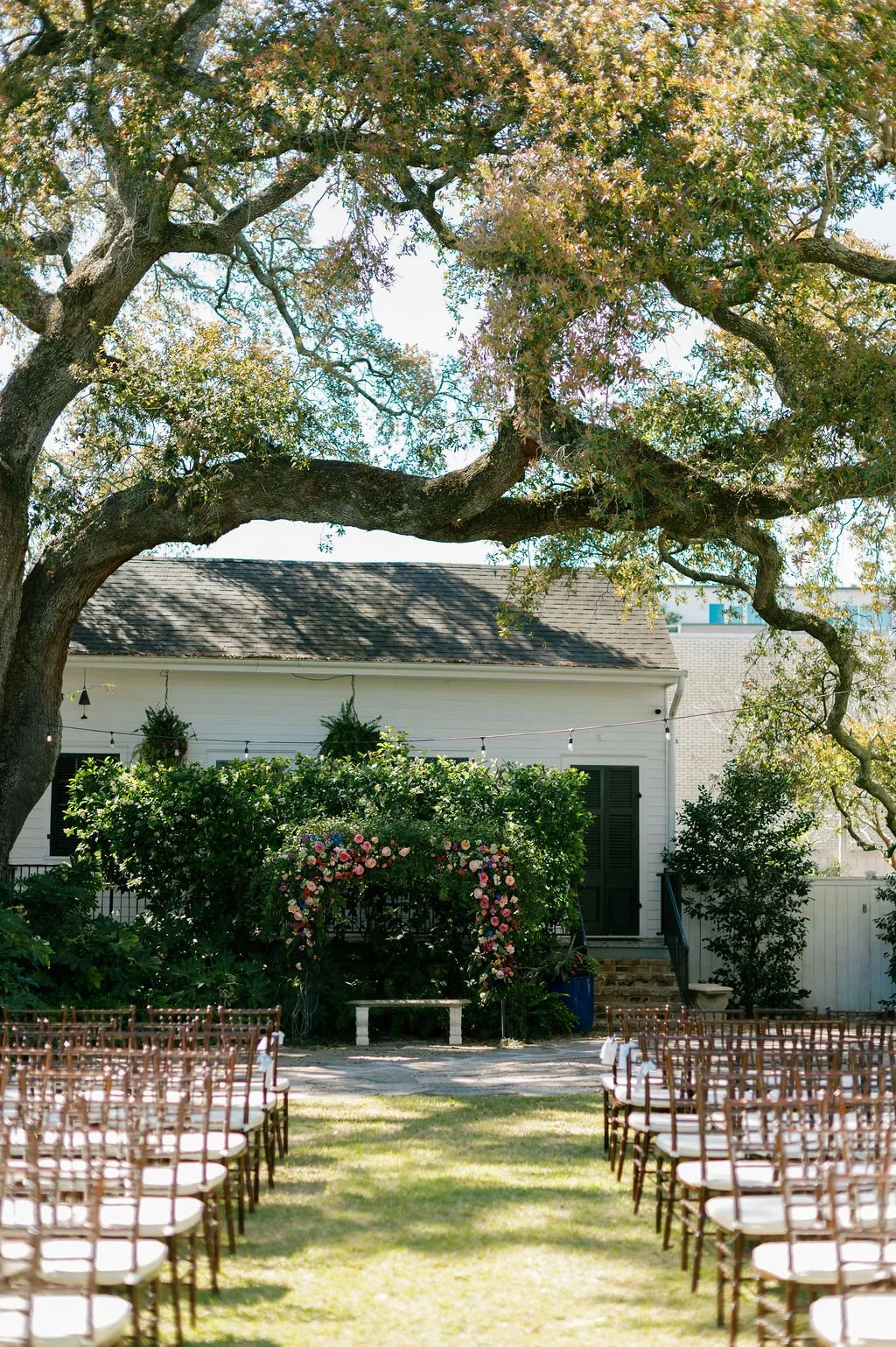 Garden ceremony setting beneath oak trees