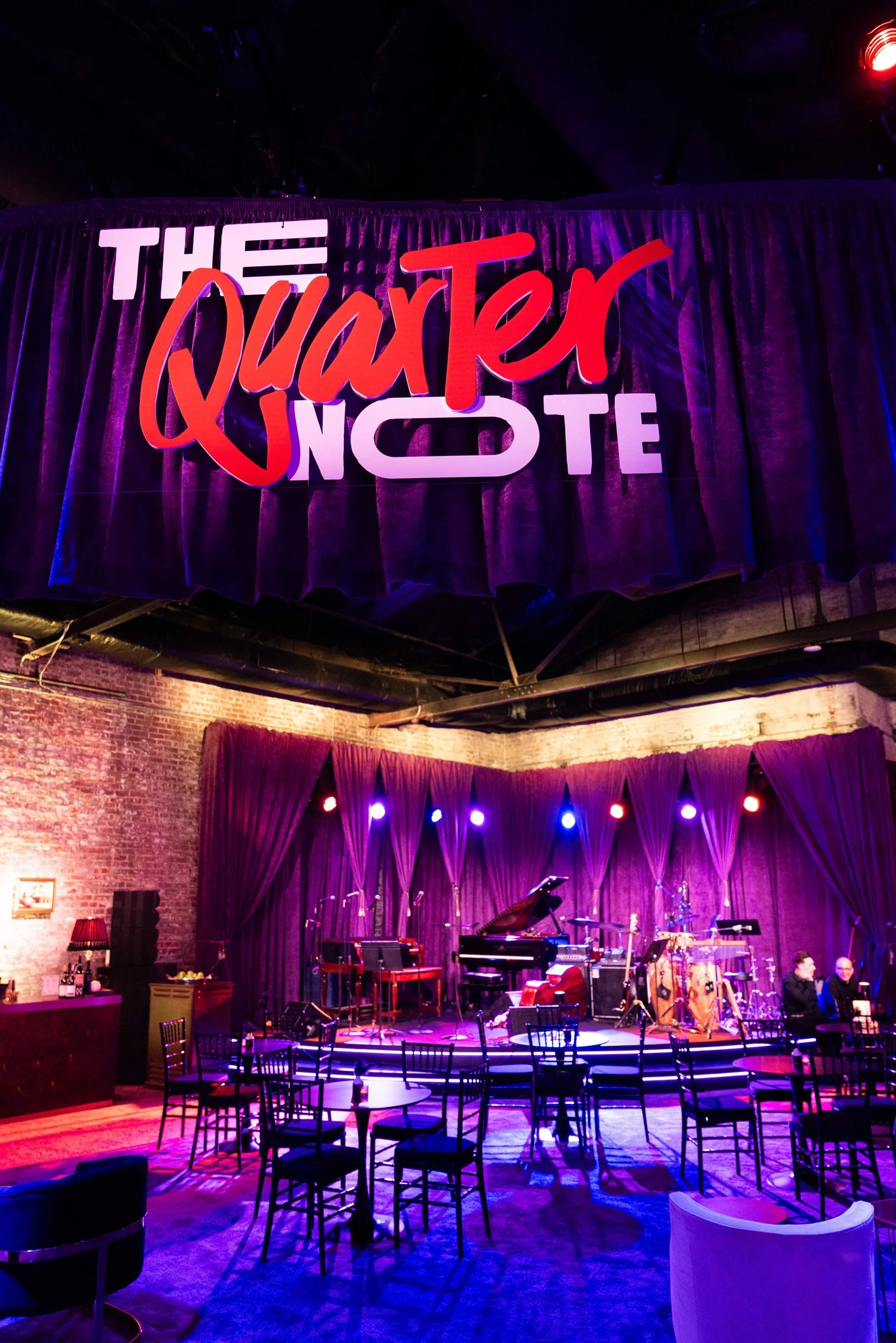 Stage with colorful lighting and live-event setup.