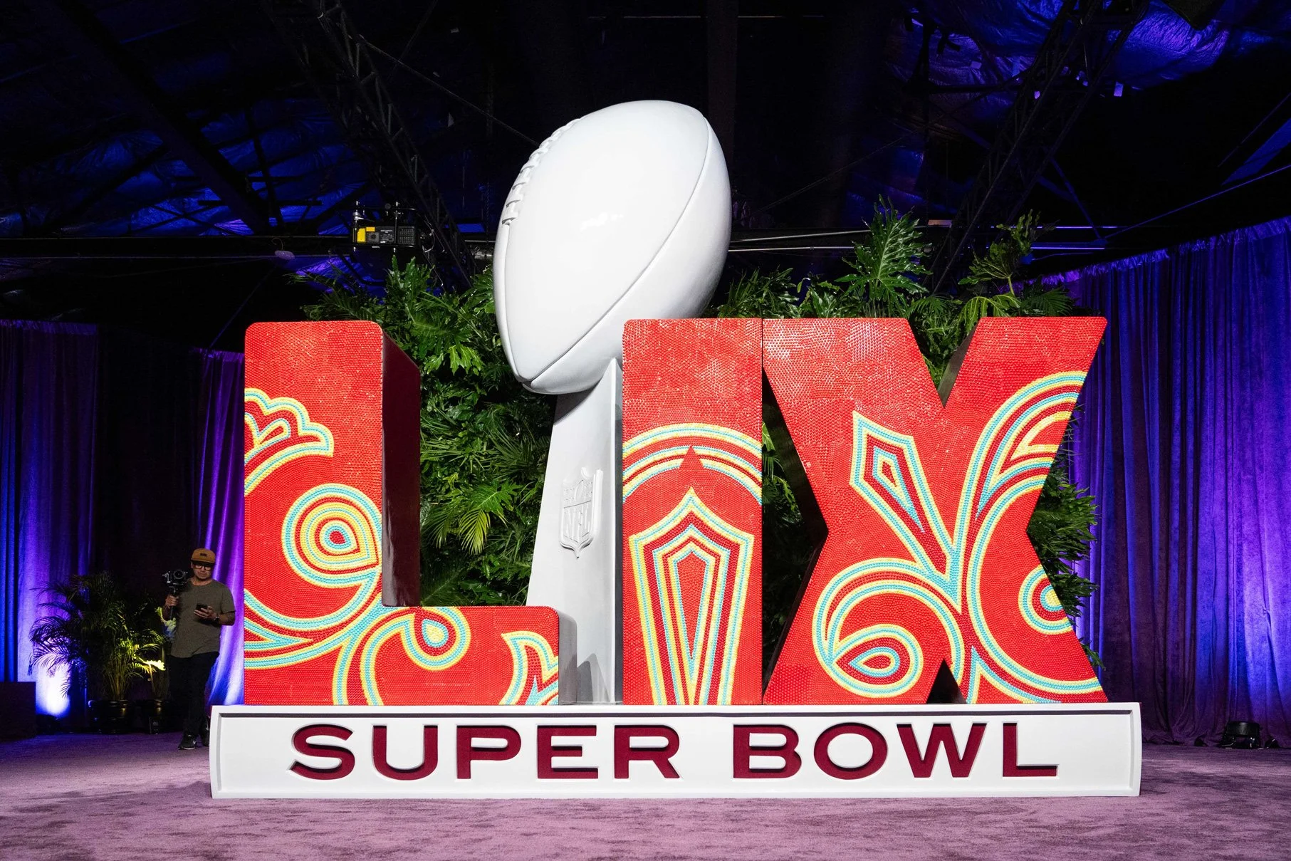 Super Bowl LIX themed décor featuring football and New Orleans-inspired elements.