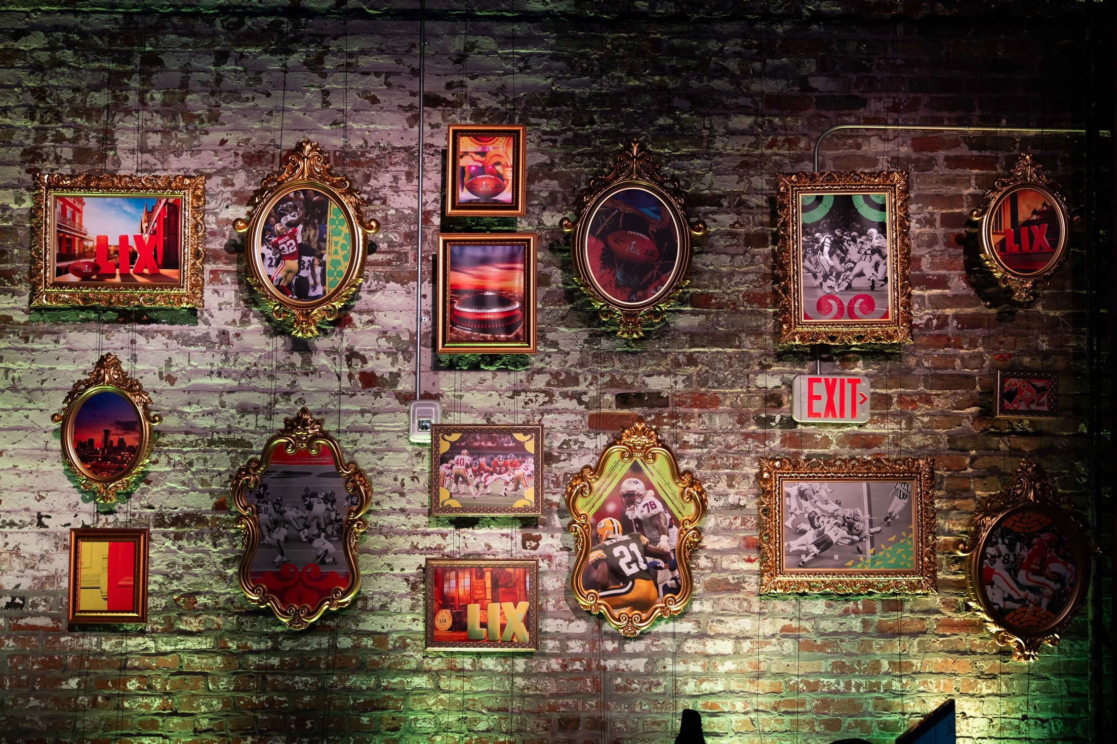 Gallery wall featuring colorful framed artwork and decorative installations.